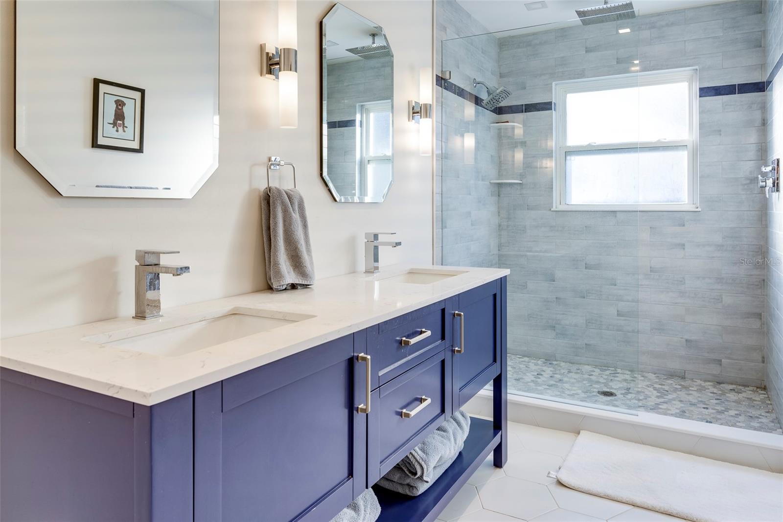 The primary bathroom was fully redesigned and reminiscent of a page in a designer magazine.
