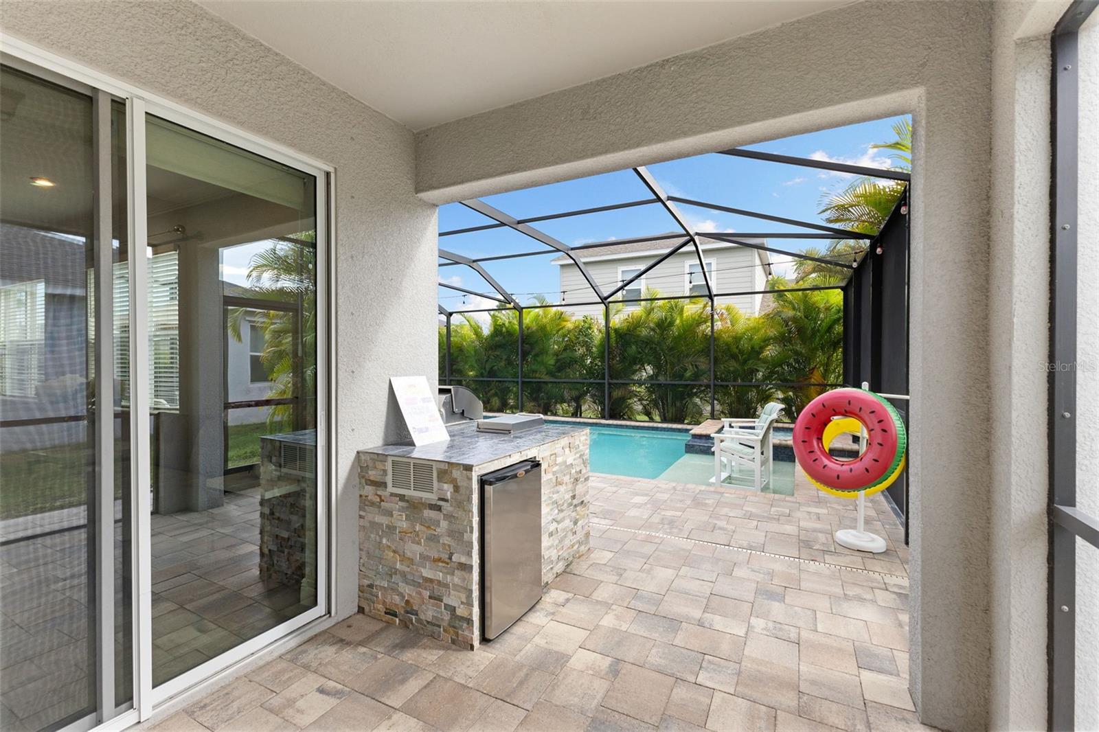 Screened lania with outdoor kitchen