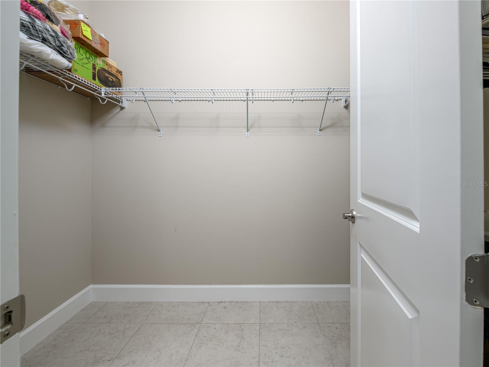 Walk in Master closet with "his" directly across