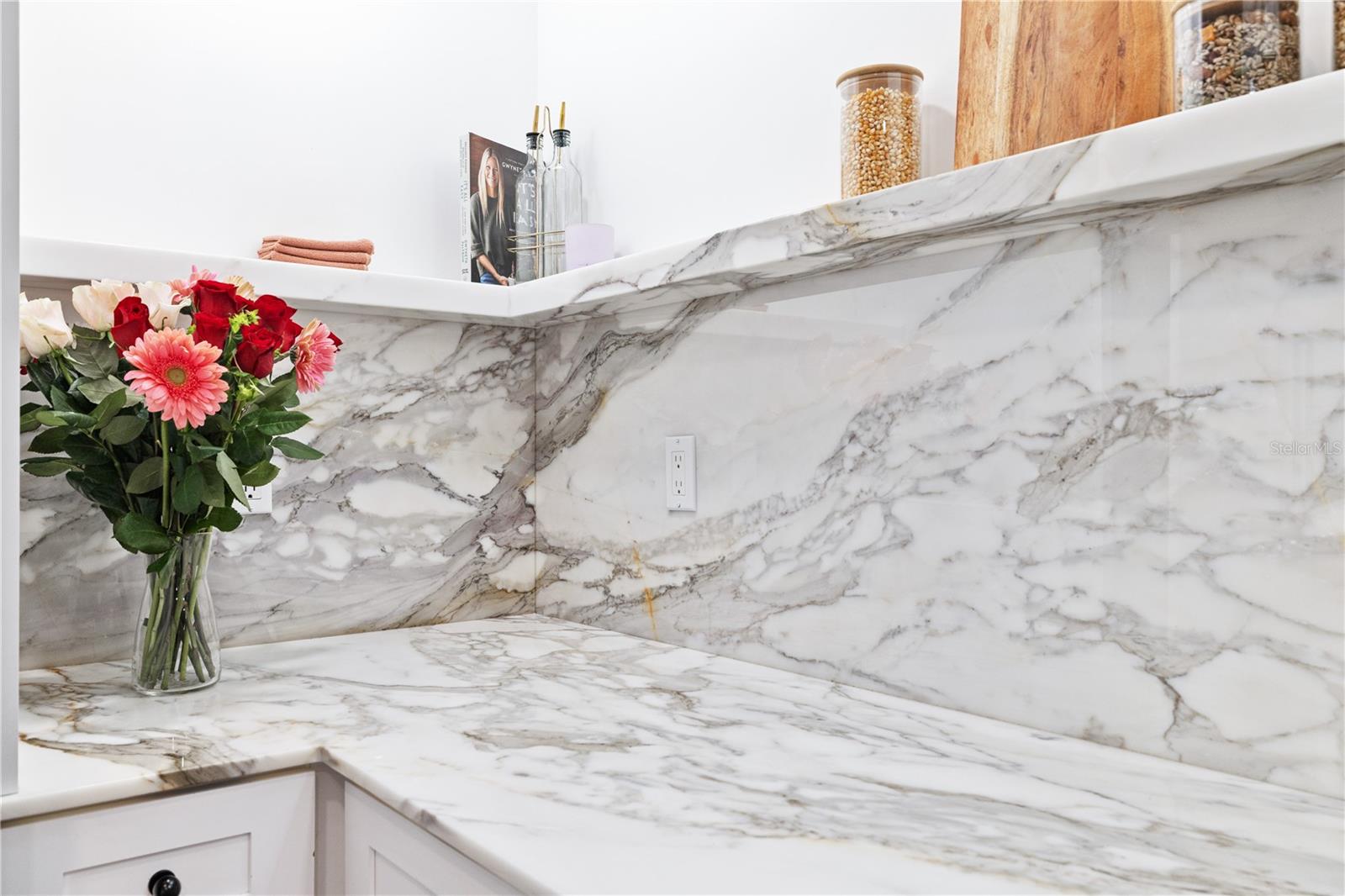 Marble backsplash with custom shelf-edge