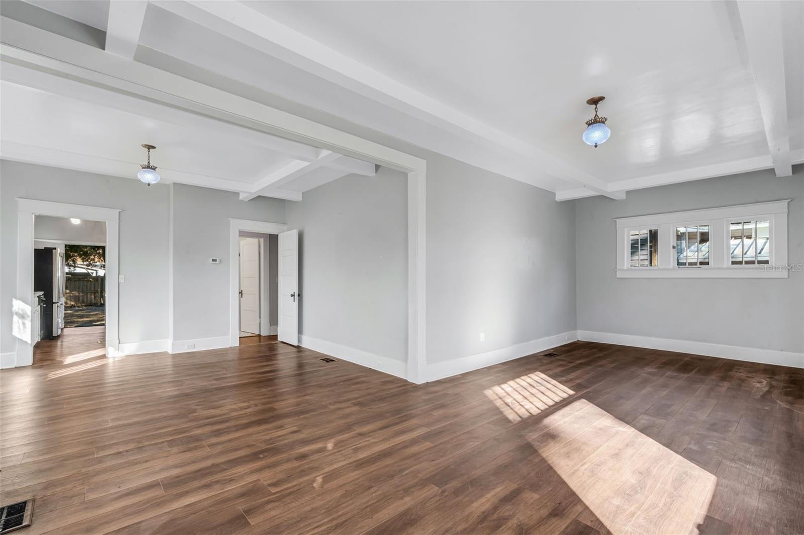 Living Room with Wood Burning Fireplace and Beautiful Ceiling Beams