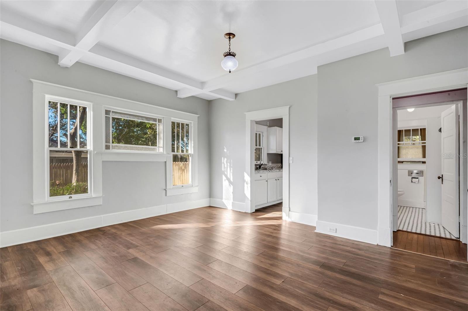 Living Room with Wood Burning Fireplace and Beautiful Ceiling Beams