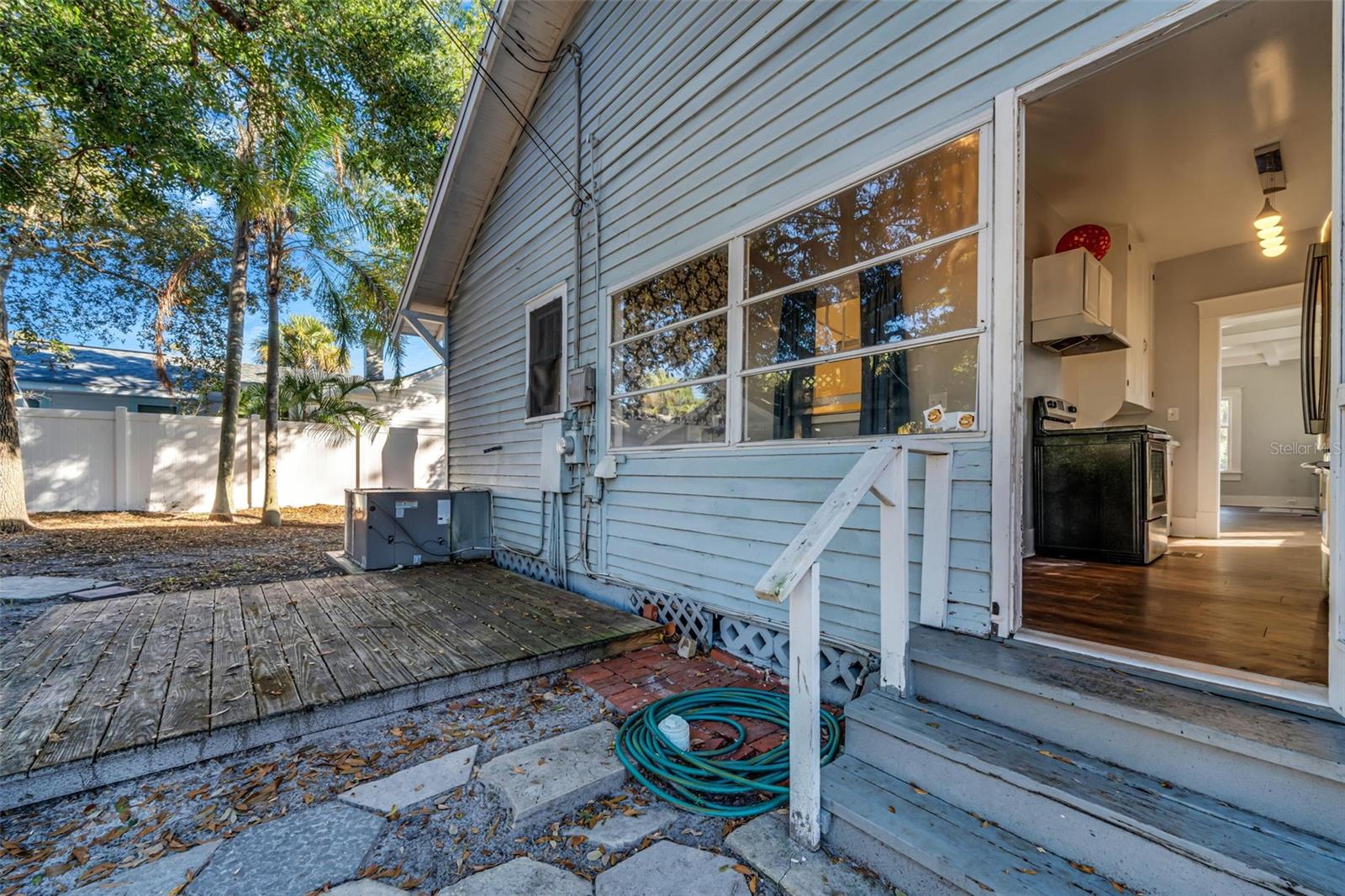 Back door entrance, large back yard with detached garage