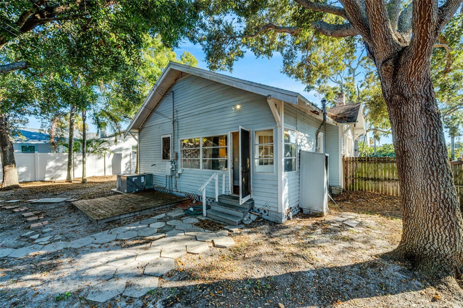 Back door entrance, large back yard with detached garage