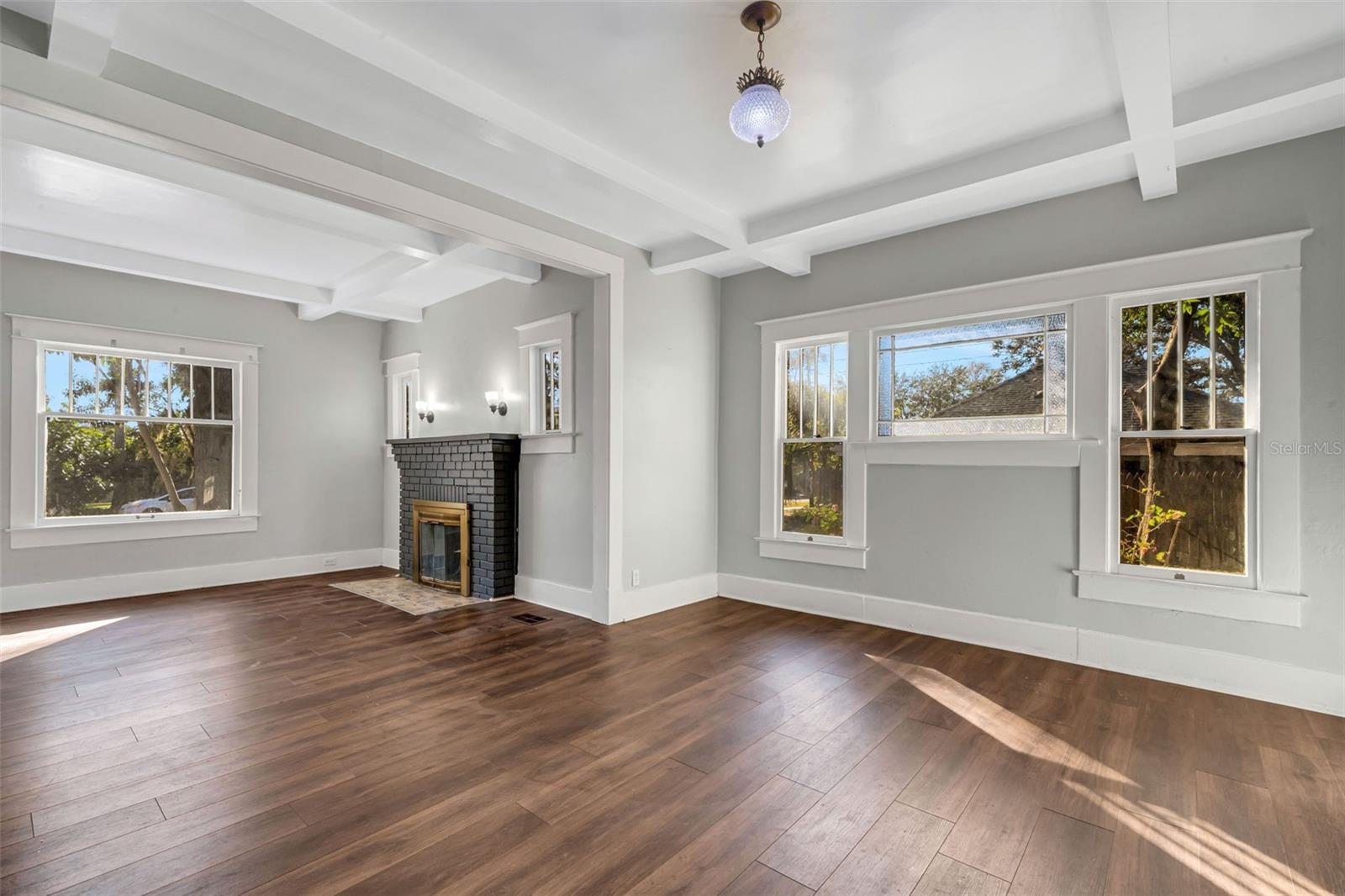 Living Room with Wood Burning Fireplace and Beautiful Ceiling Beams