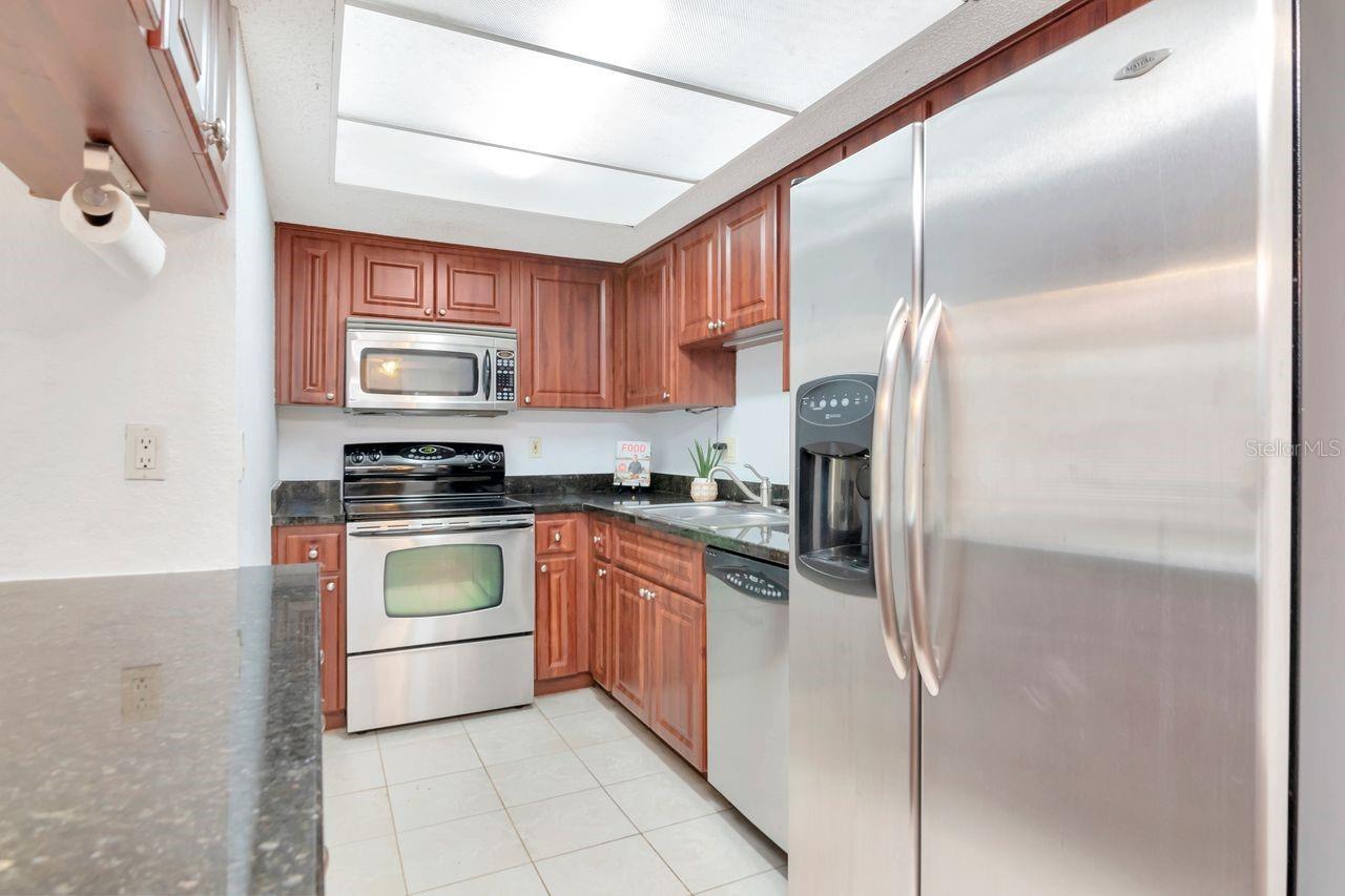 Kitchen featuring granite countertops and stainless steel appliances.