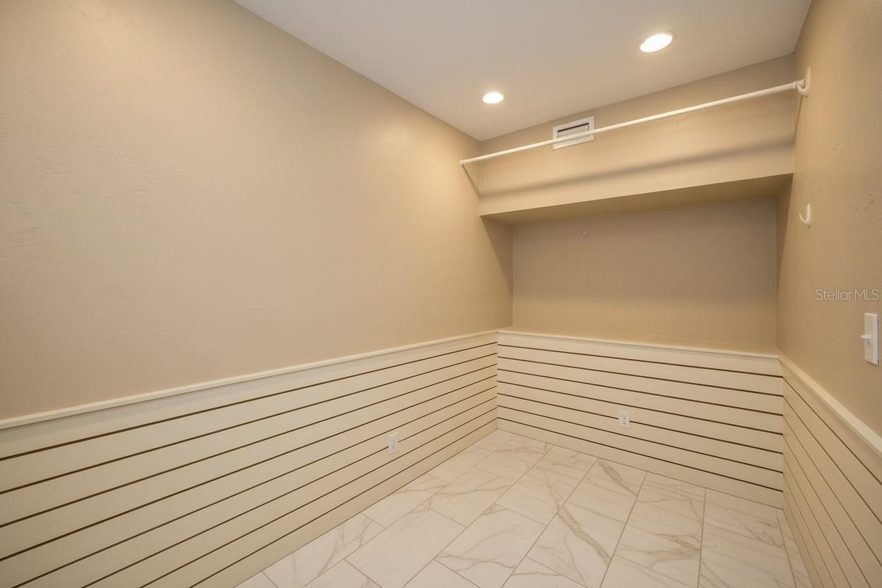 Primary Walk-in Closet Virtually Staged