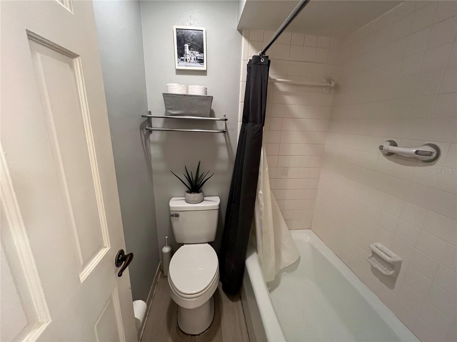 Water closet with toilet and bathtub/shower combo