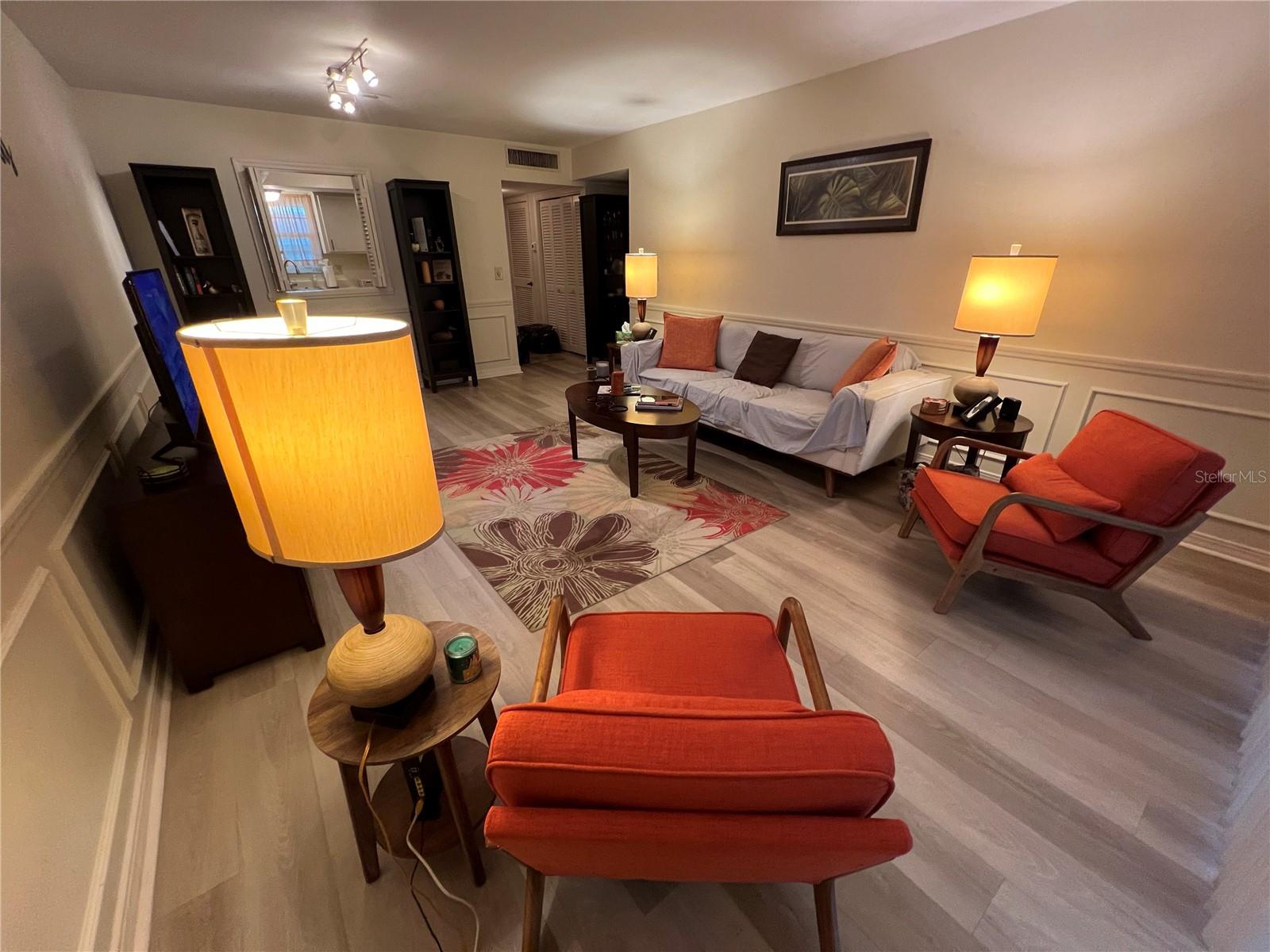 Large, warm living room adjoins kitchen.