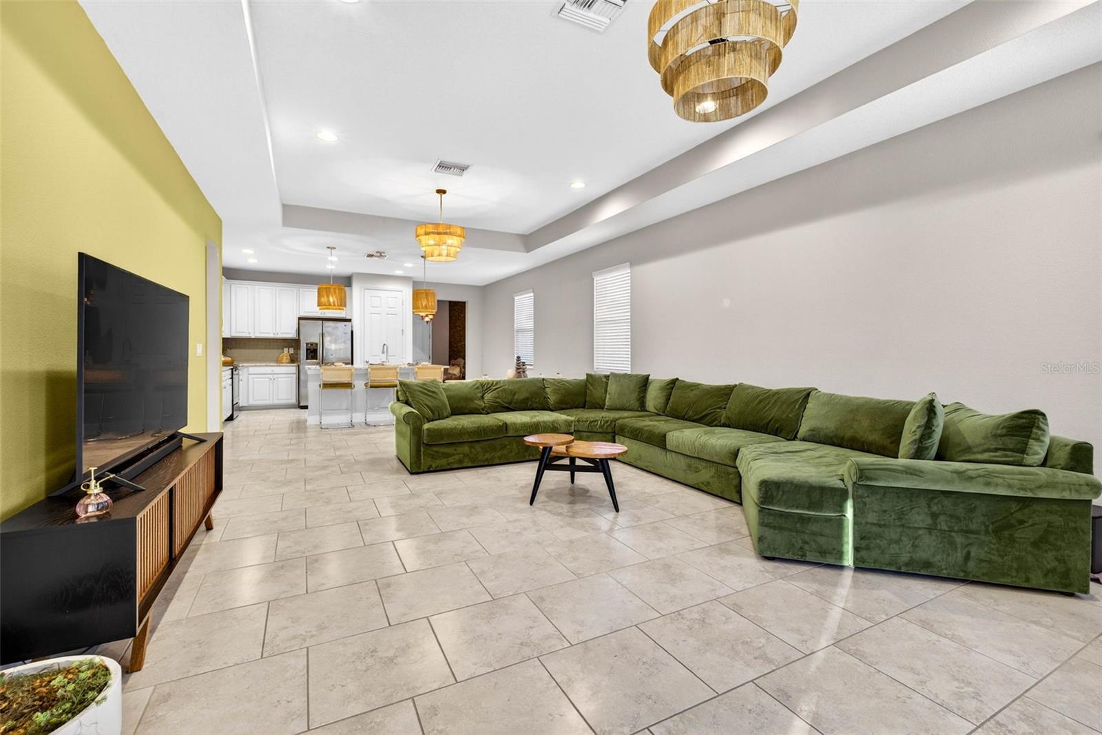 Grand space in the great room can also fit a dining table or open it up to a large sectional.