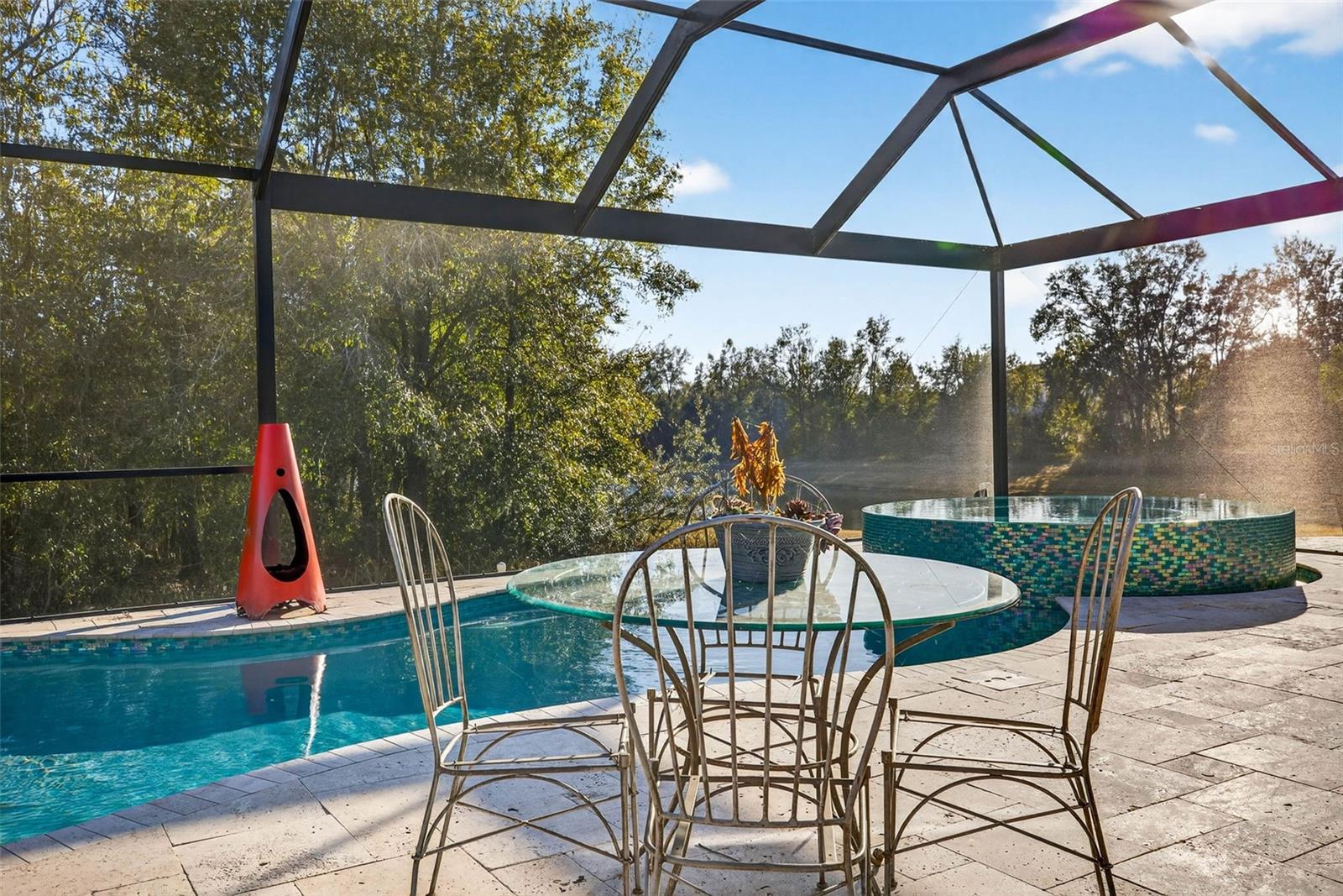 Pool has glass tile throughout