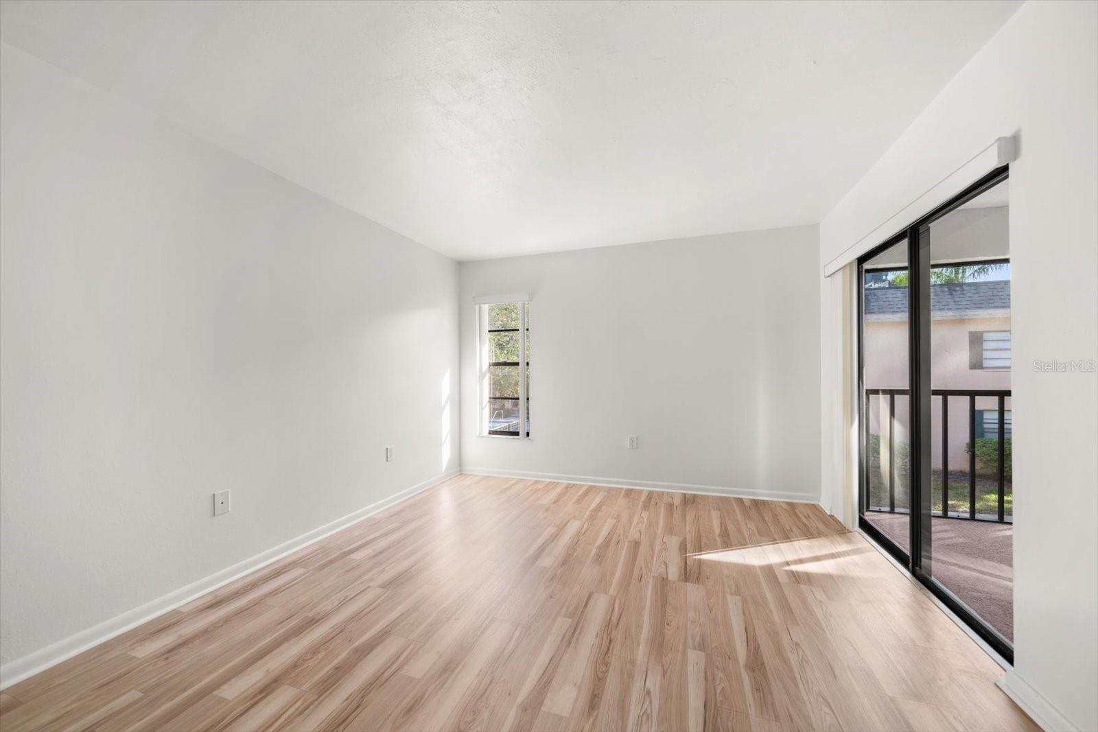 Master bedroom w/sliding door to screened in porch