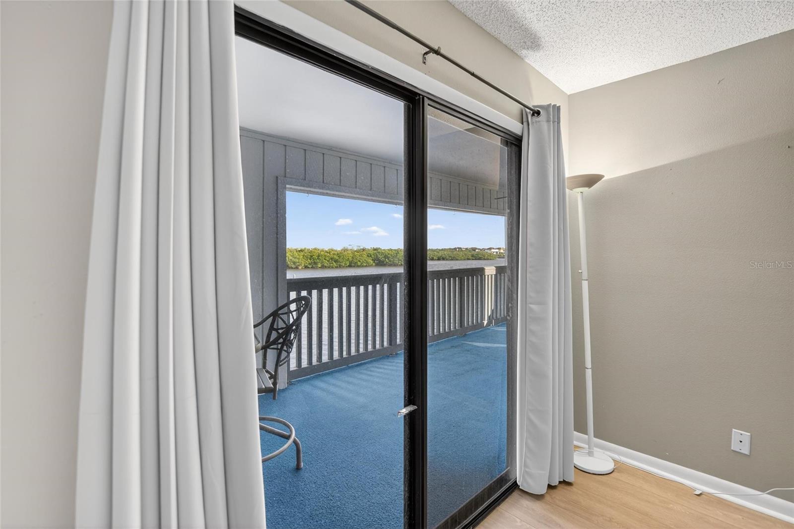 Lanai Access w/Water View from Primary Bedroom