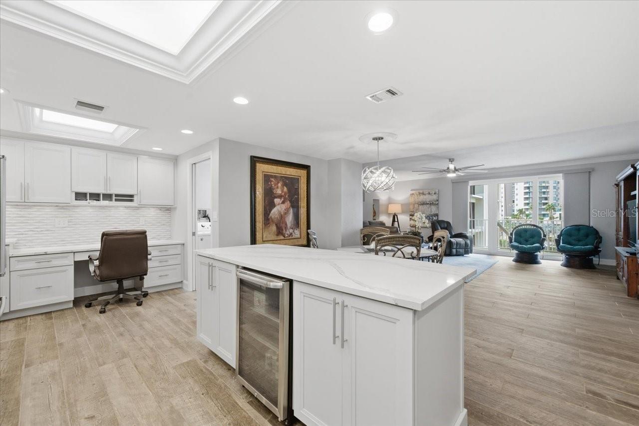 Wine fridge- extra cabinet space and pull outs for easy reach.