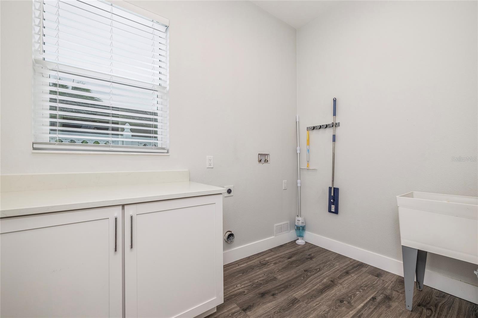 Large utility room with washer and dryer hook ups