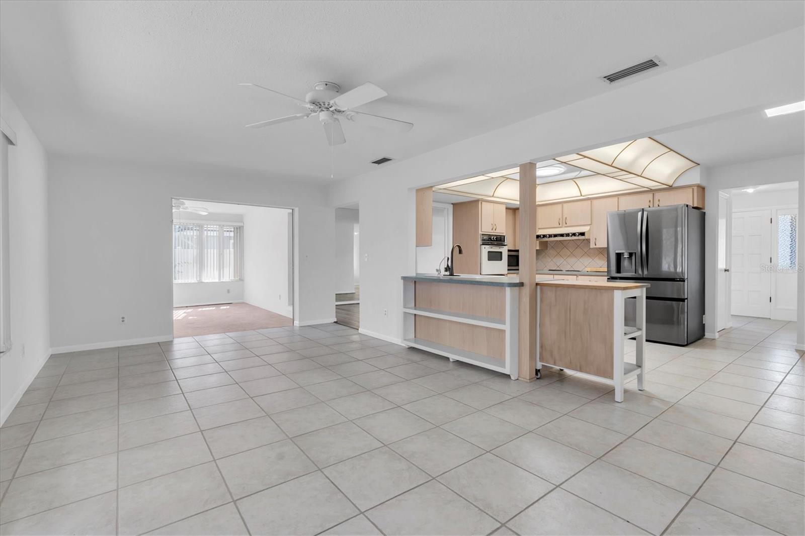 Family room looking into kitchen and Florida Room