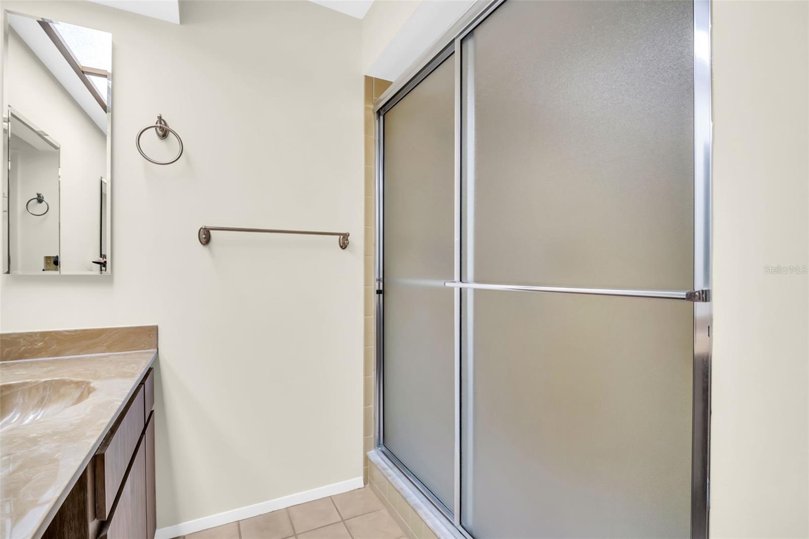 Walk-in shower with glass slider~