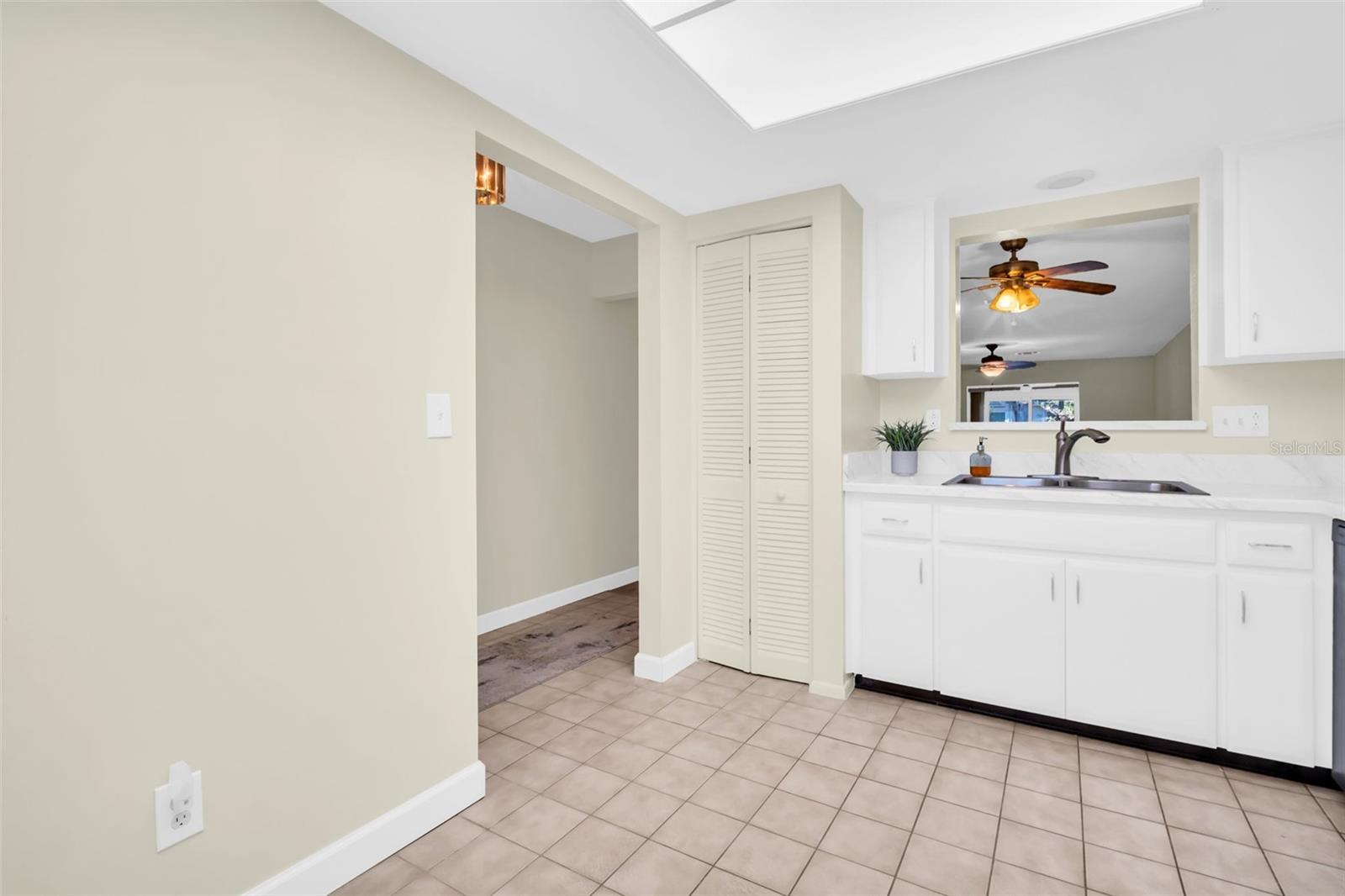 Convenient kitchen pass-through to dining & gracious kitchen pantry closet~
