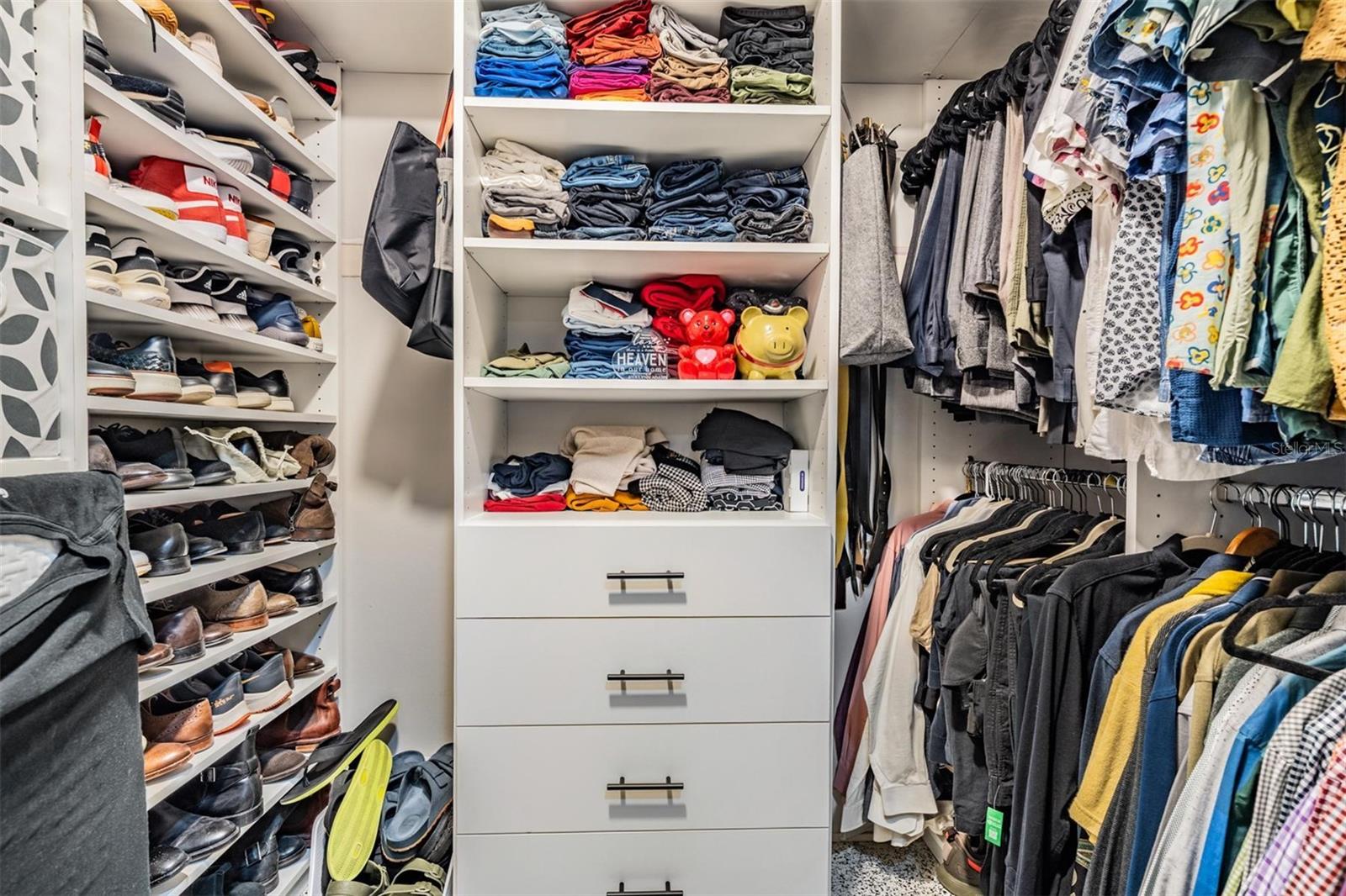 Primary bedroom walk in closet