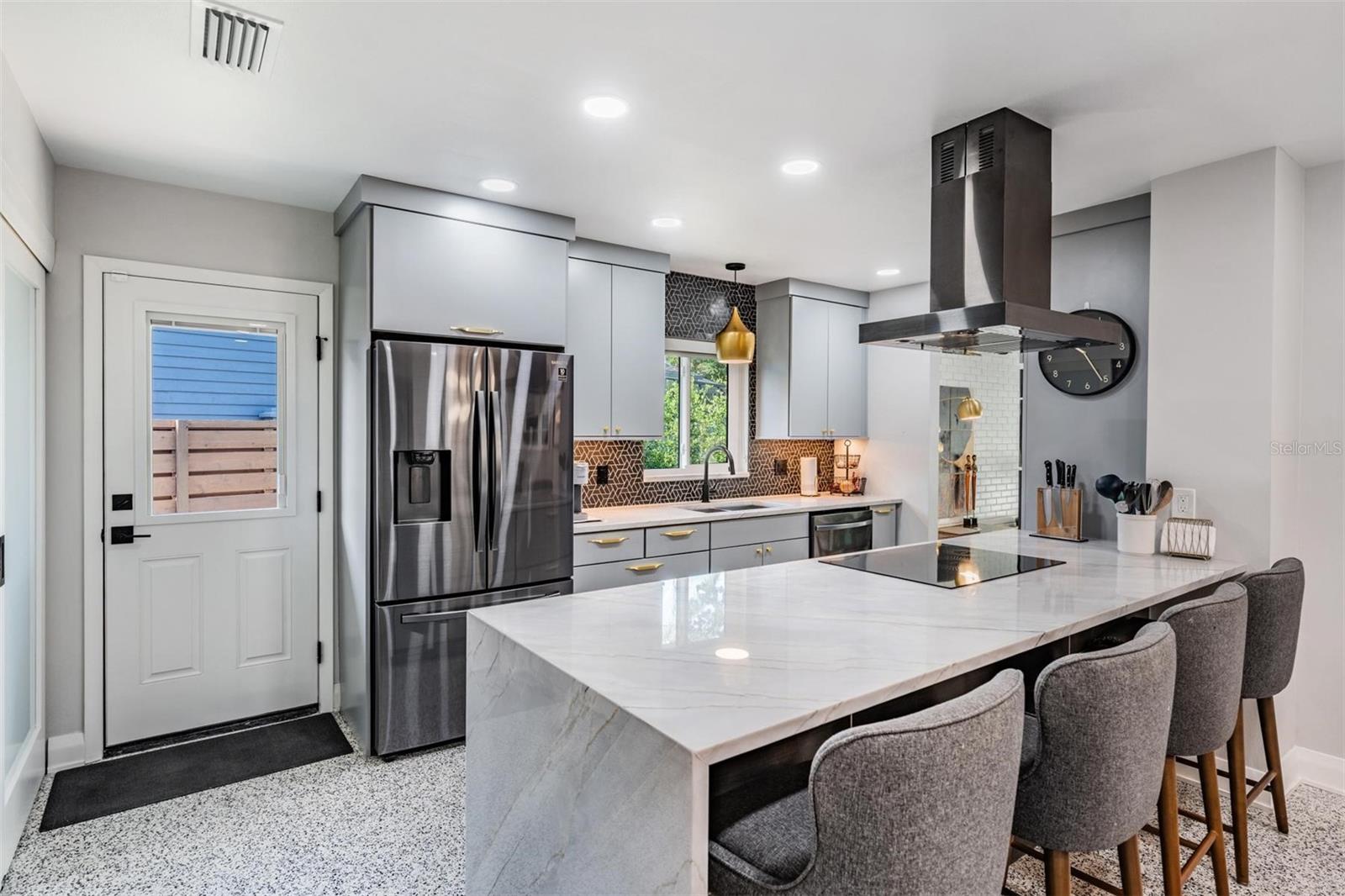 Waterfall peninsula with counter height breakfast bar