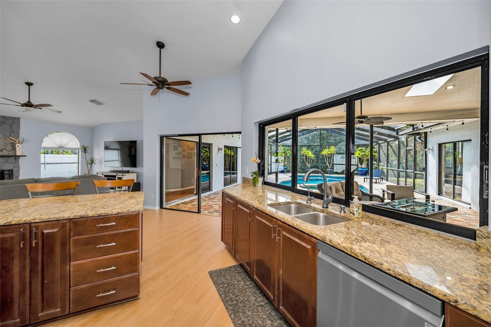 Kitchen is open to the pool area and family room