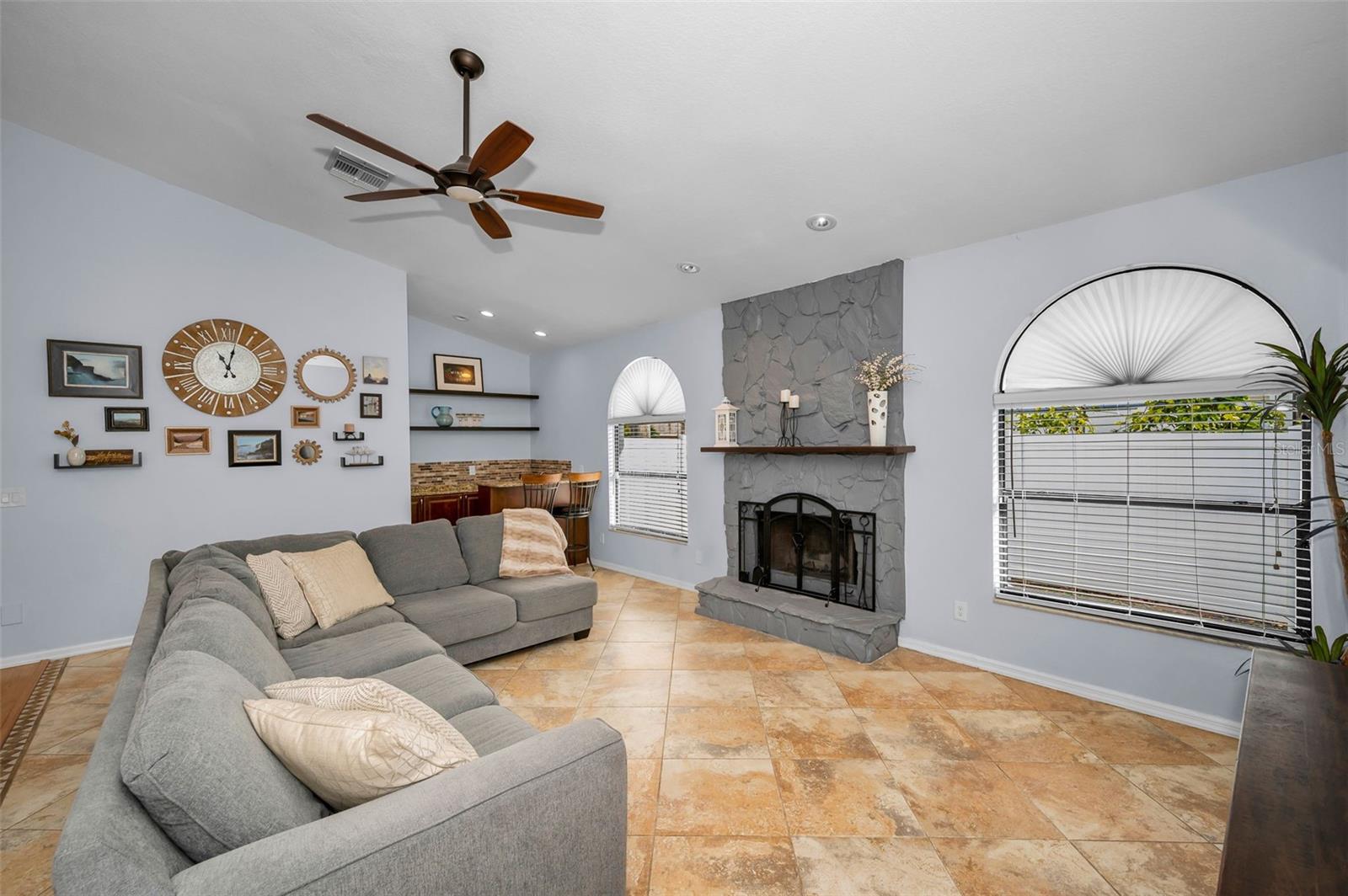 Spacious Gathering room with fireplace and wet bar.
