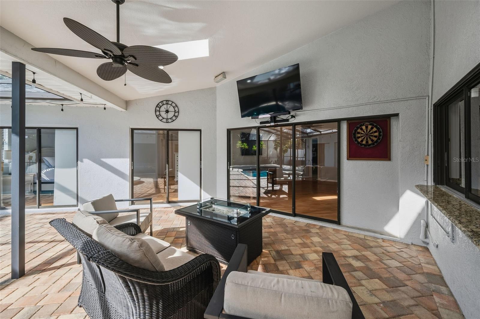 Covered Lanai with kitchen pass thru window for easy entertaining