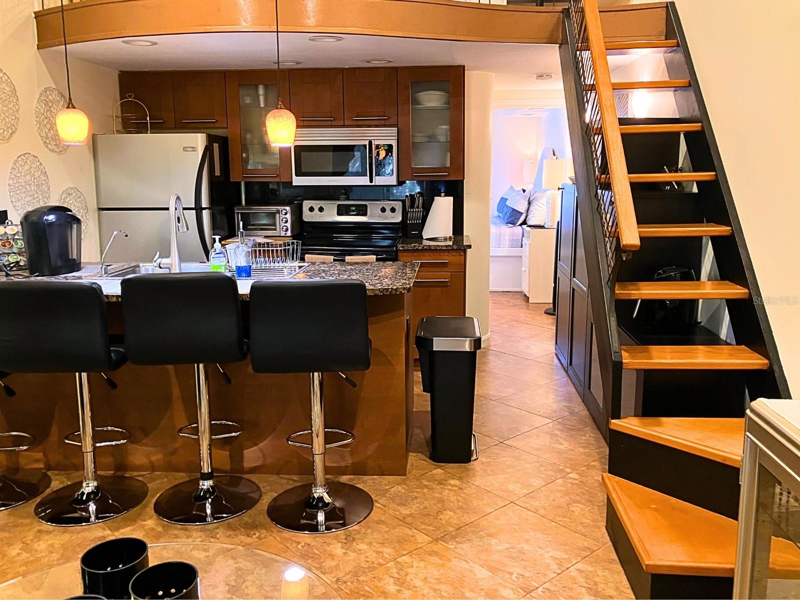 Loft space above kitchen for an office, bed, storage