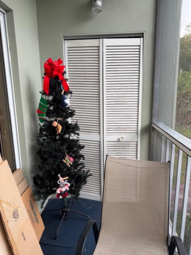 Screened balcony with small storage at end