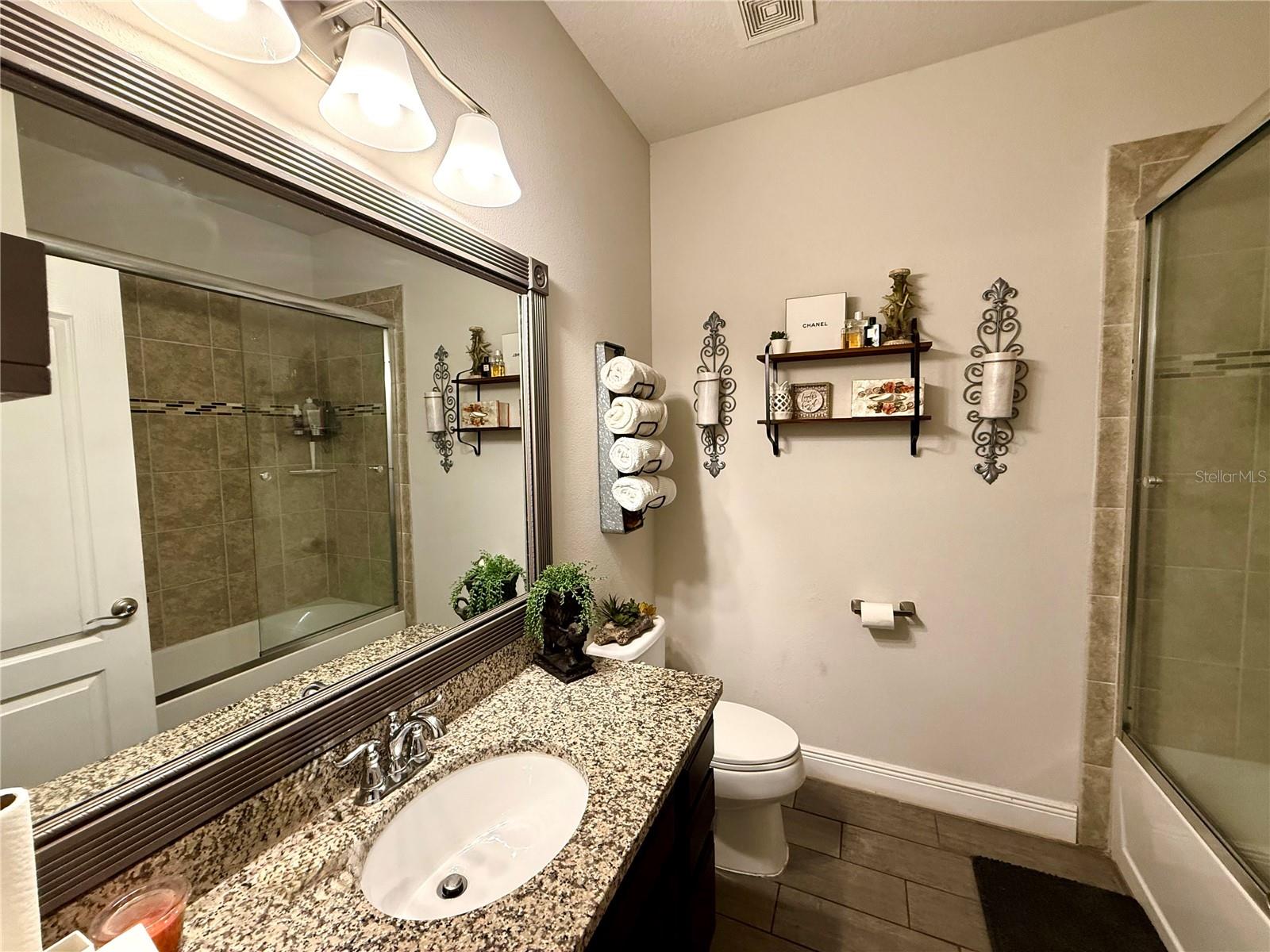 Bathroom 1 with glass enclosed tub/shower