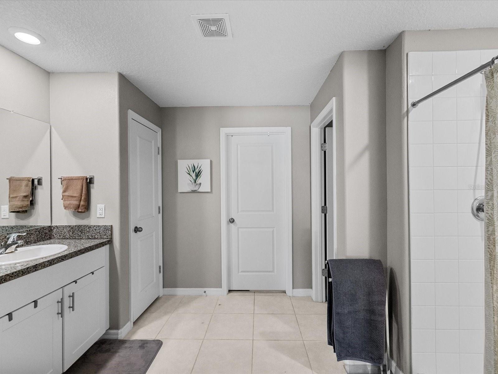 Stunning master bathroom with plenty of storage and space