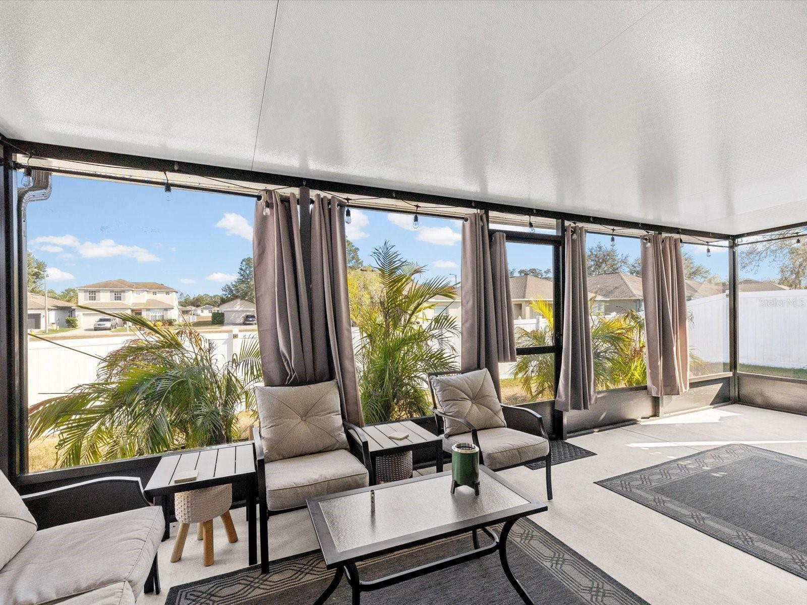 Updated  and oversized private screened in porch-perfect for entertaining