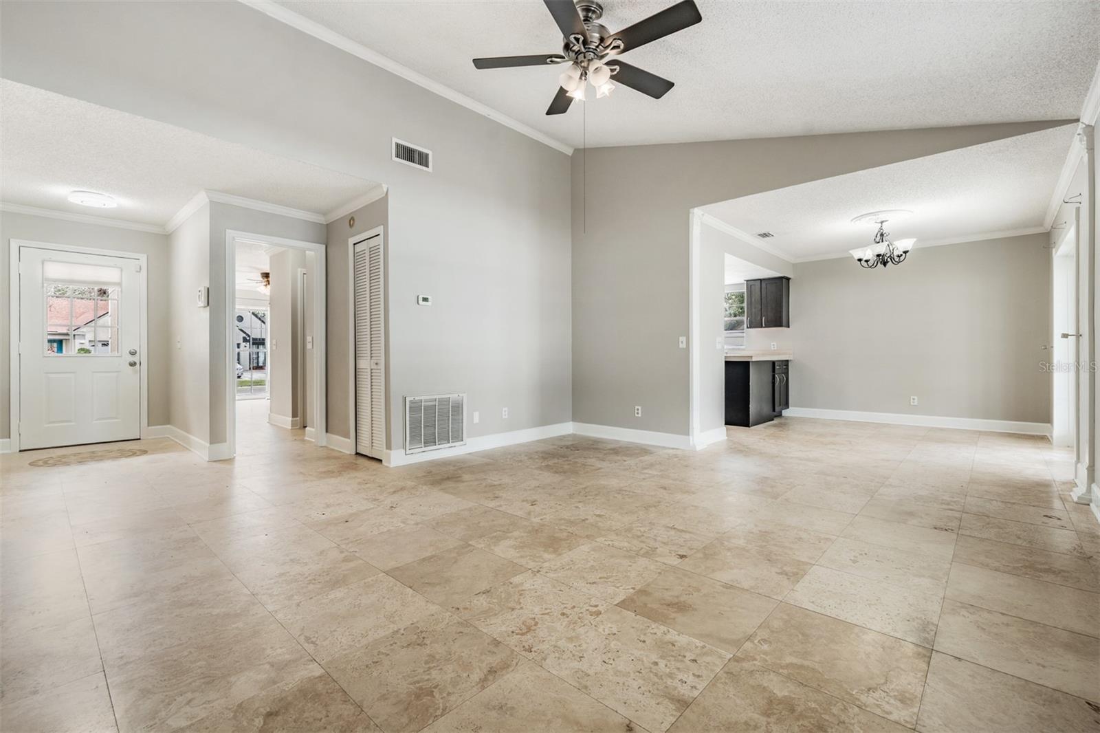 Front entry to Great room with dining an kitchen nearby