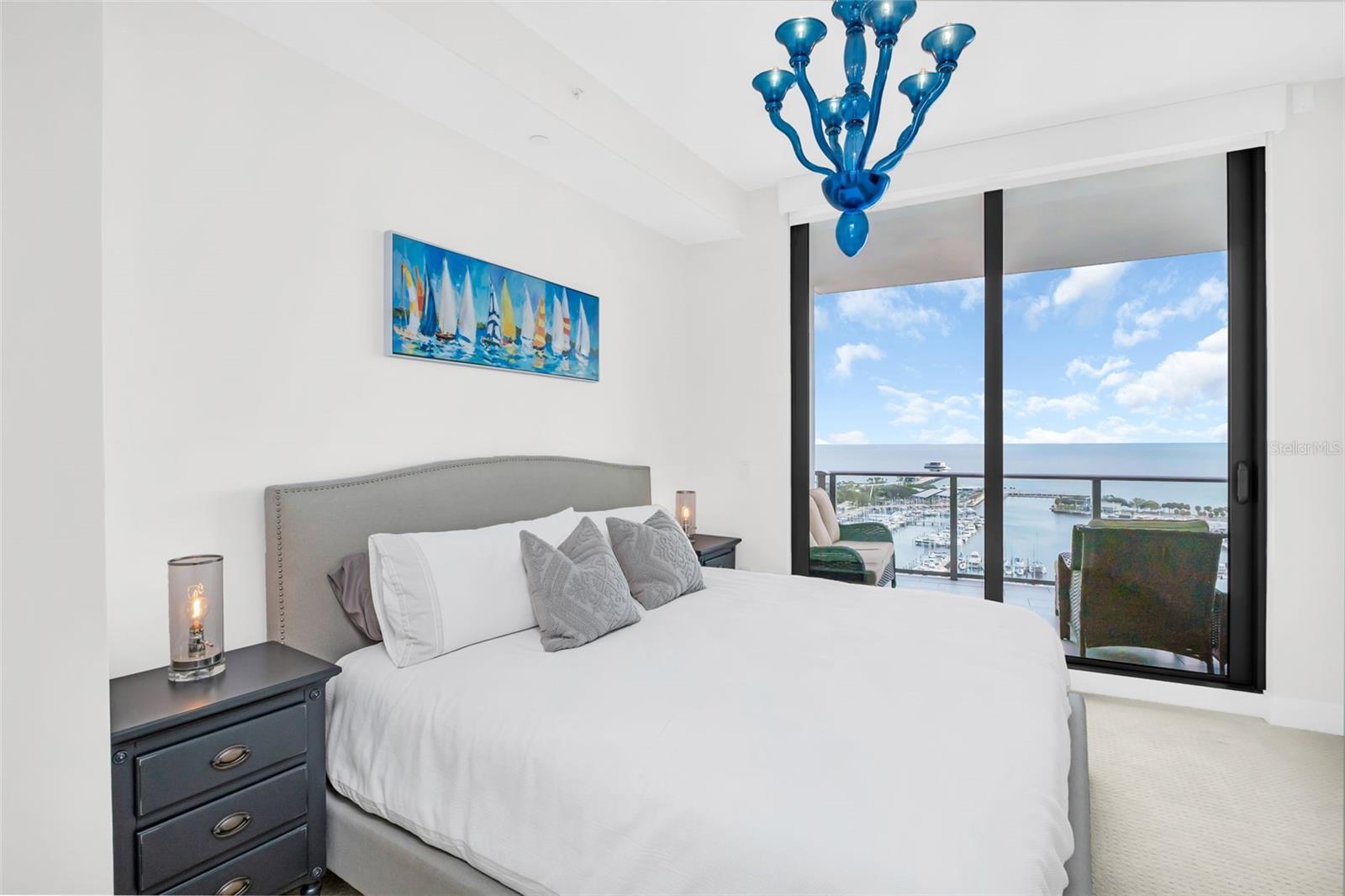 Guest bedroom with stunning water view and access to the terrace
