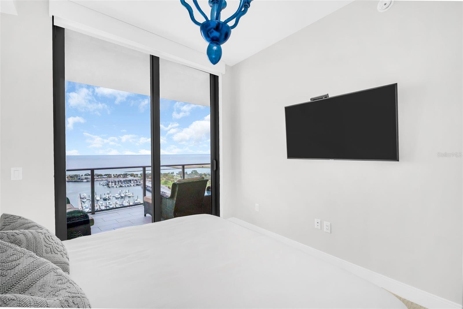 Guest bedroom with stunning water view and access to the terrace