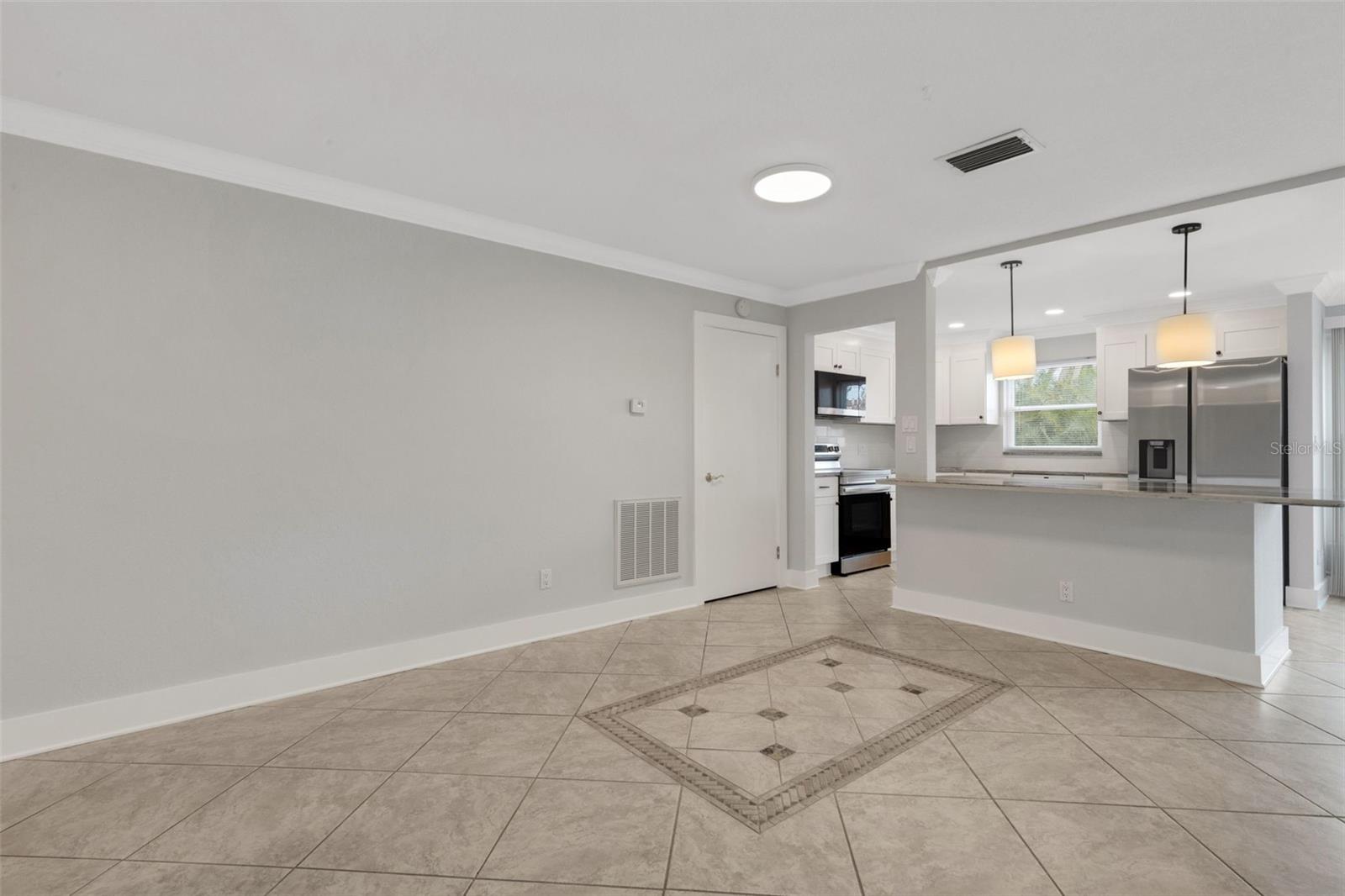 Dining Area. Interior Door Off Kitchen is to A/C Unit, Water heater and Storage Area