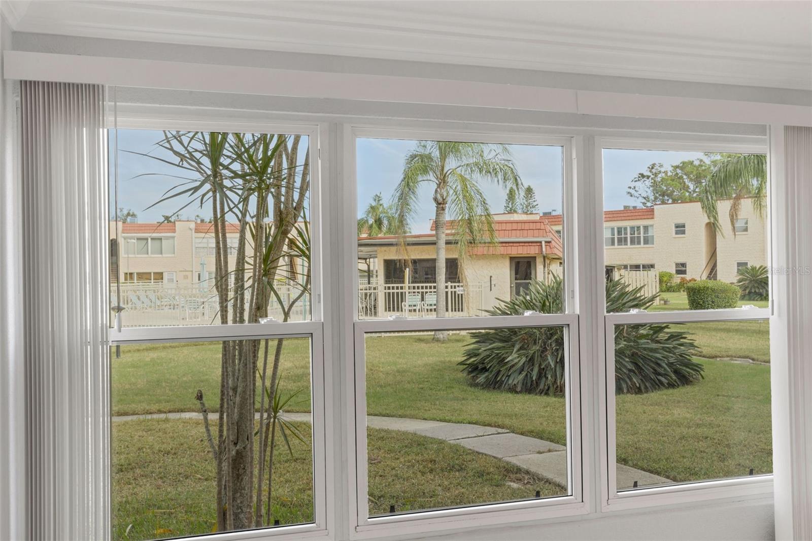 View From Florida Room to Pool and Clubhouse