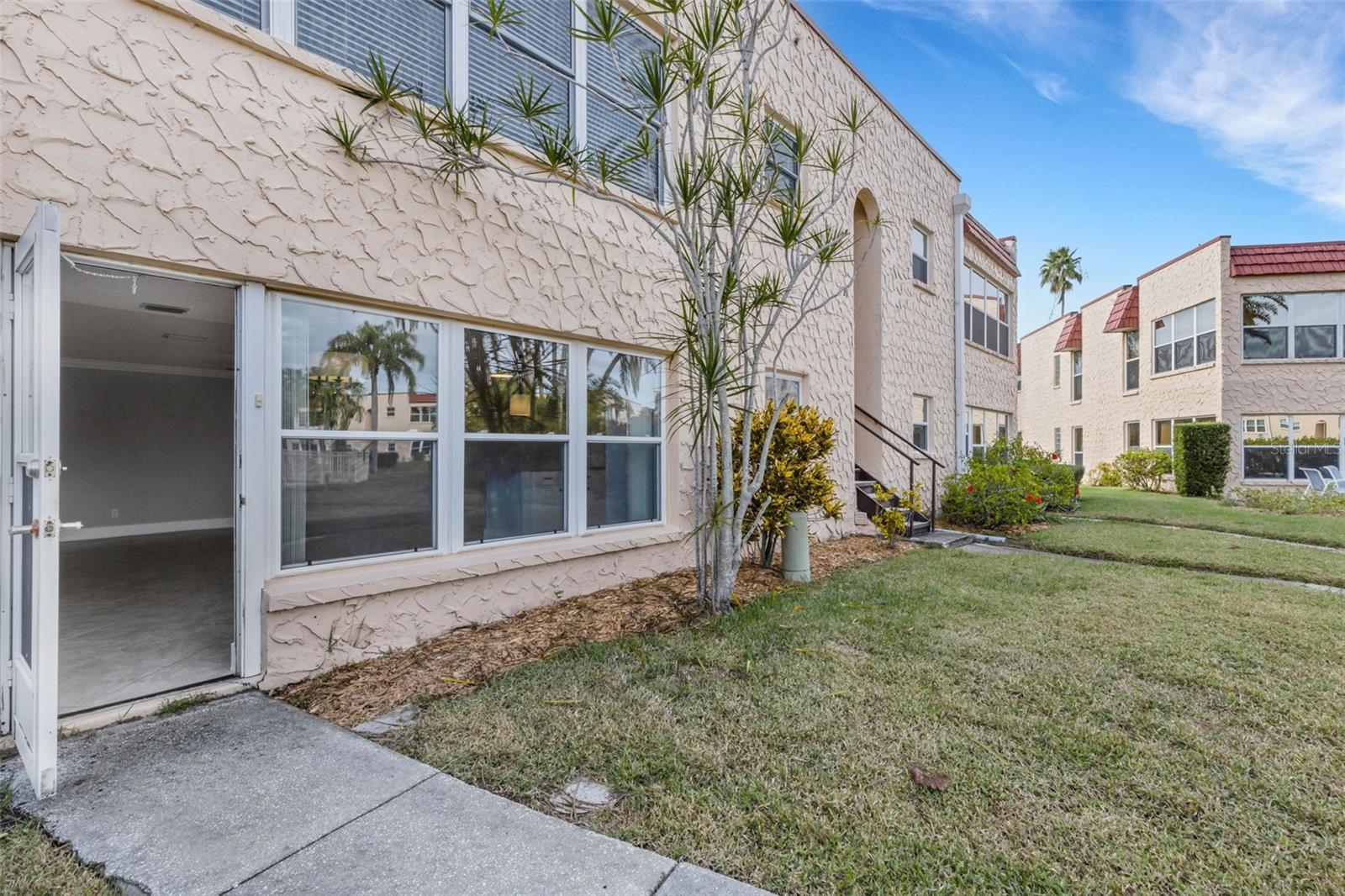 Rear of Unit with Walkway to Pool and Clubhouse