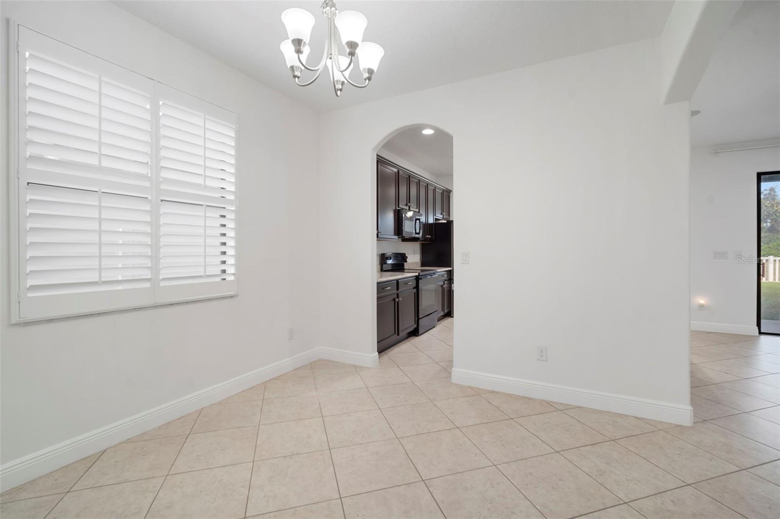 Dining room looking into kitchen.