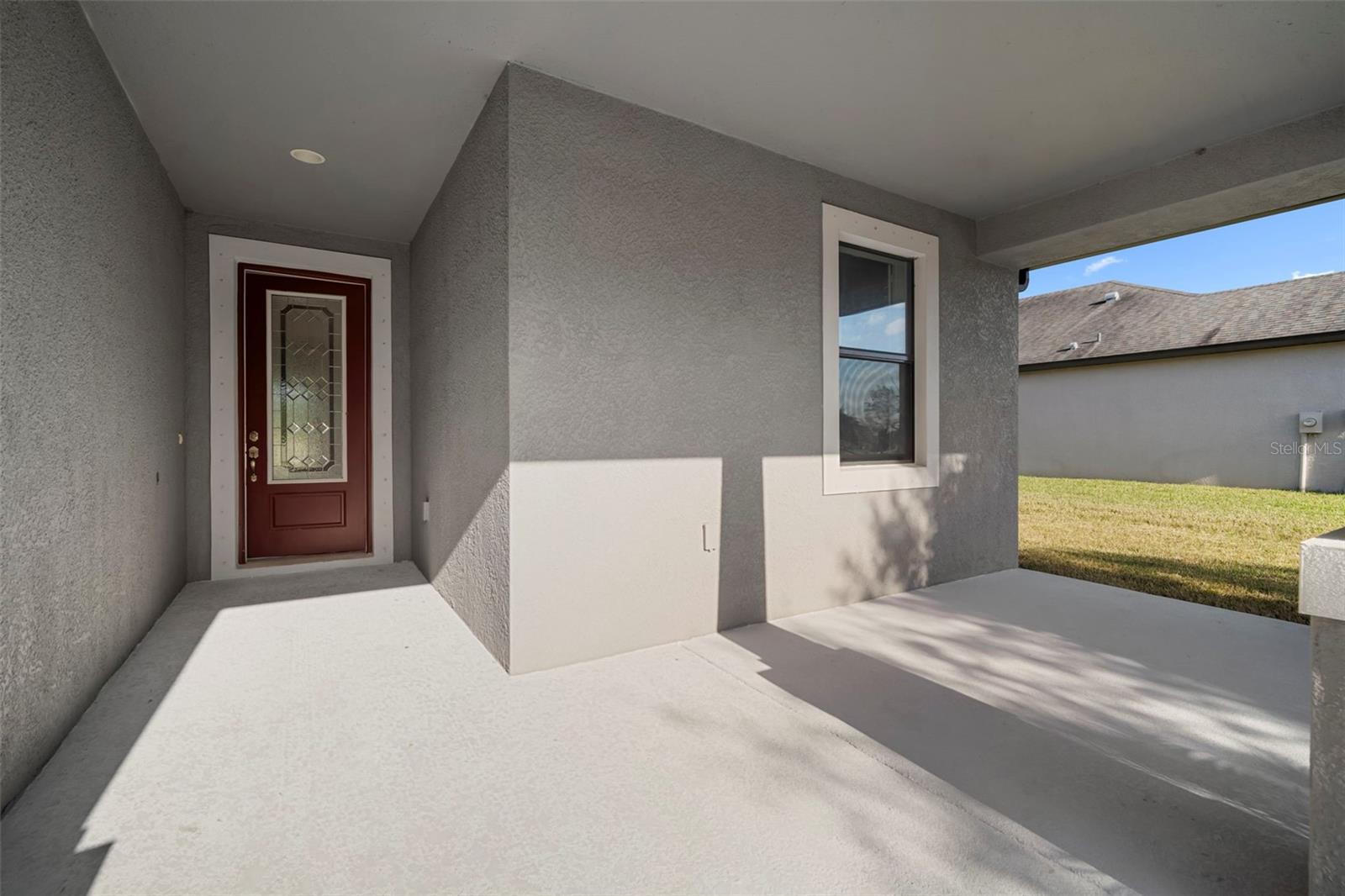 Front doorway and covered front porch.