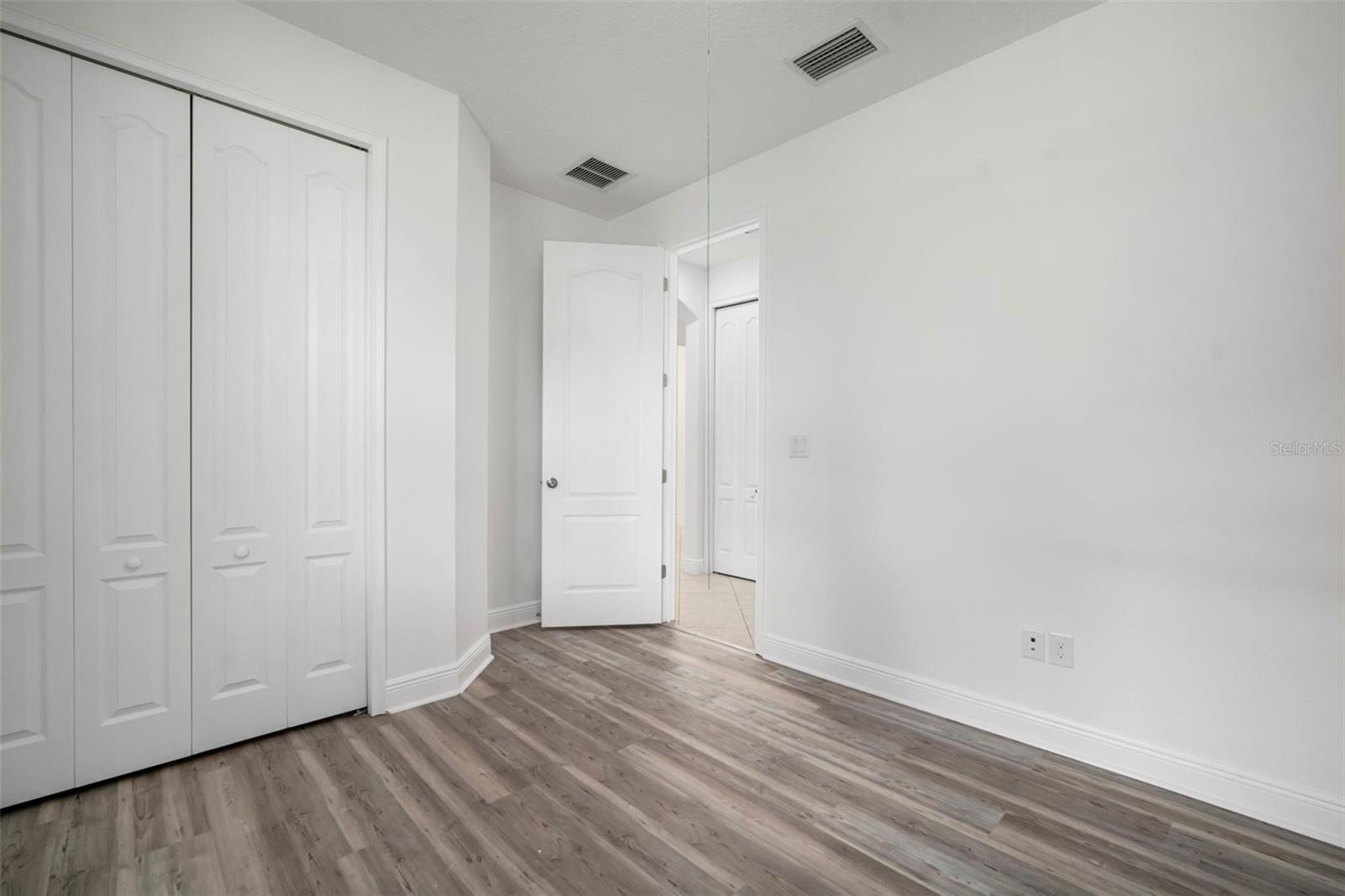 Bedroom 1 closet and doorway.