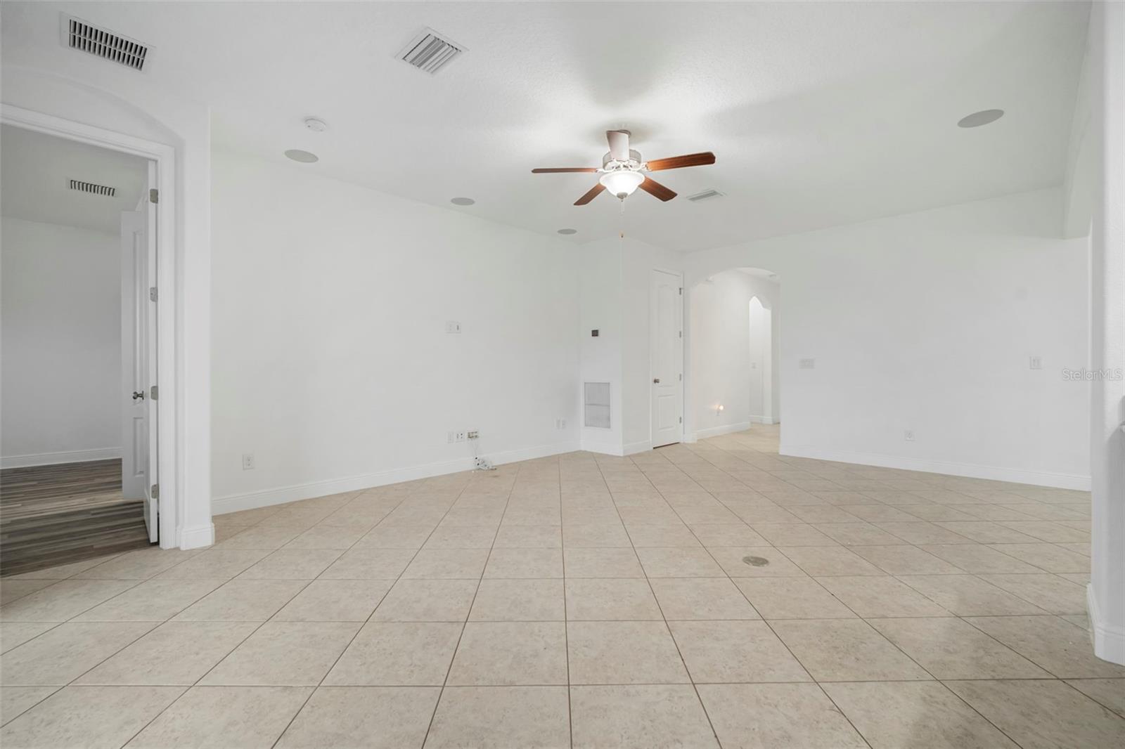 Living room looking into front door entrance hallway.