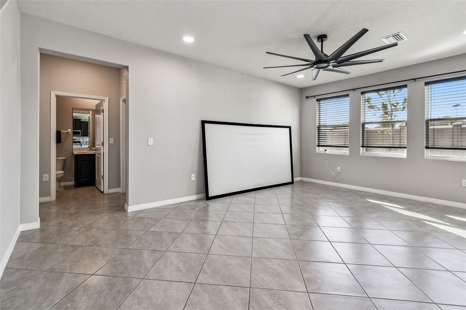 Living room and entry to first floor full bath and bedroom