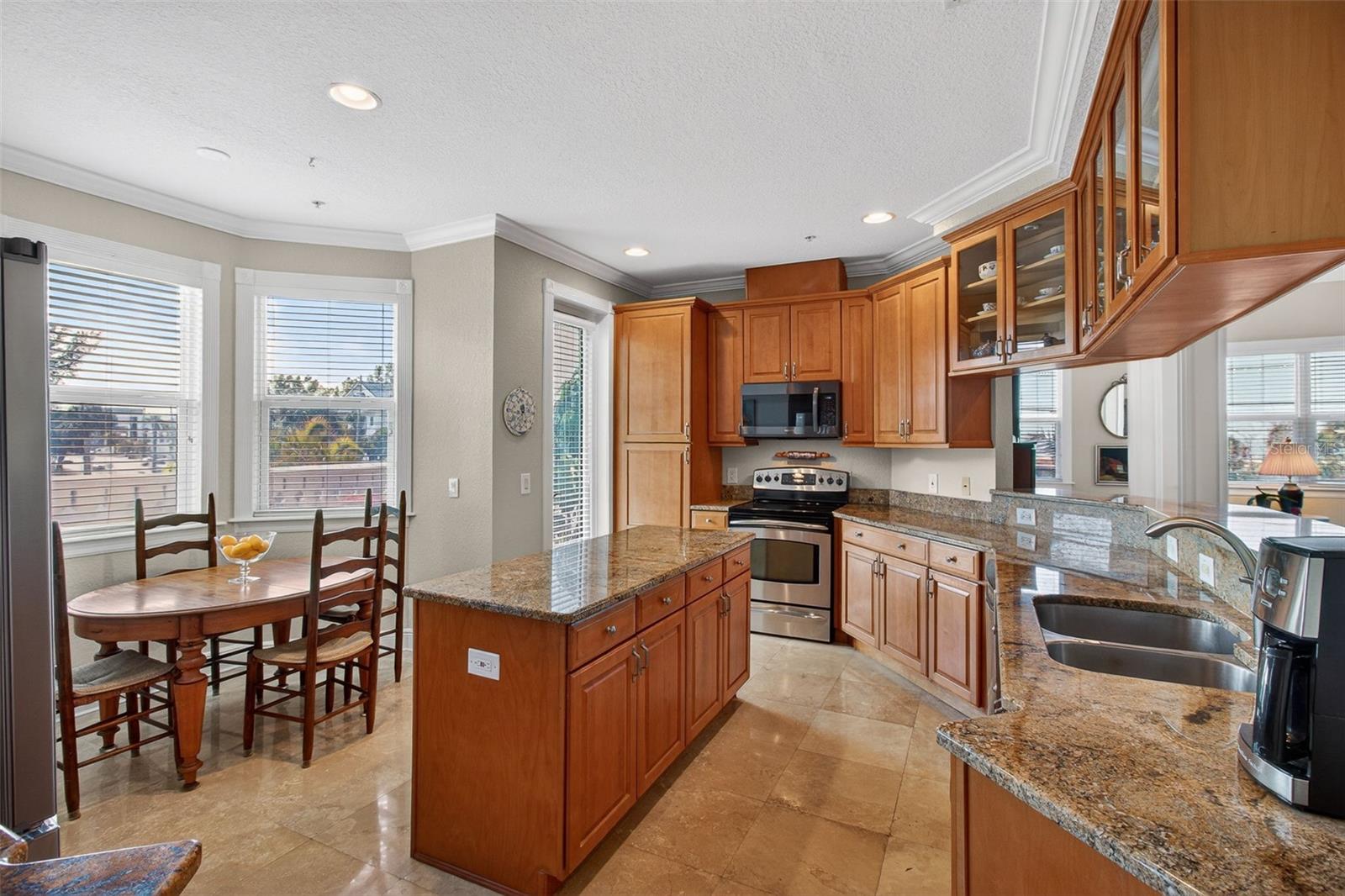 Spacious kitchen with island and balcony access w/ Gulf Views