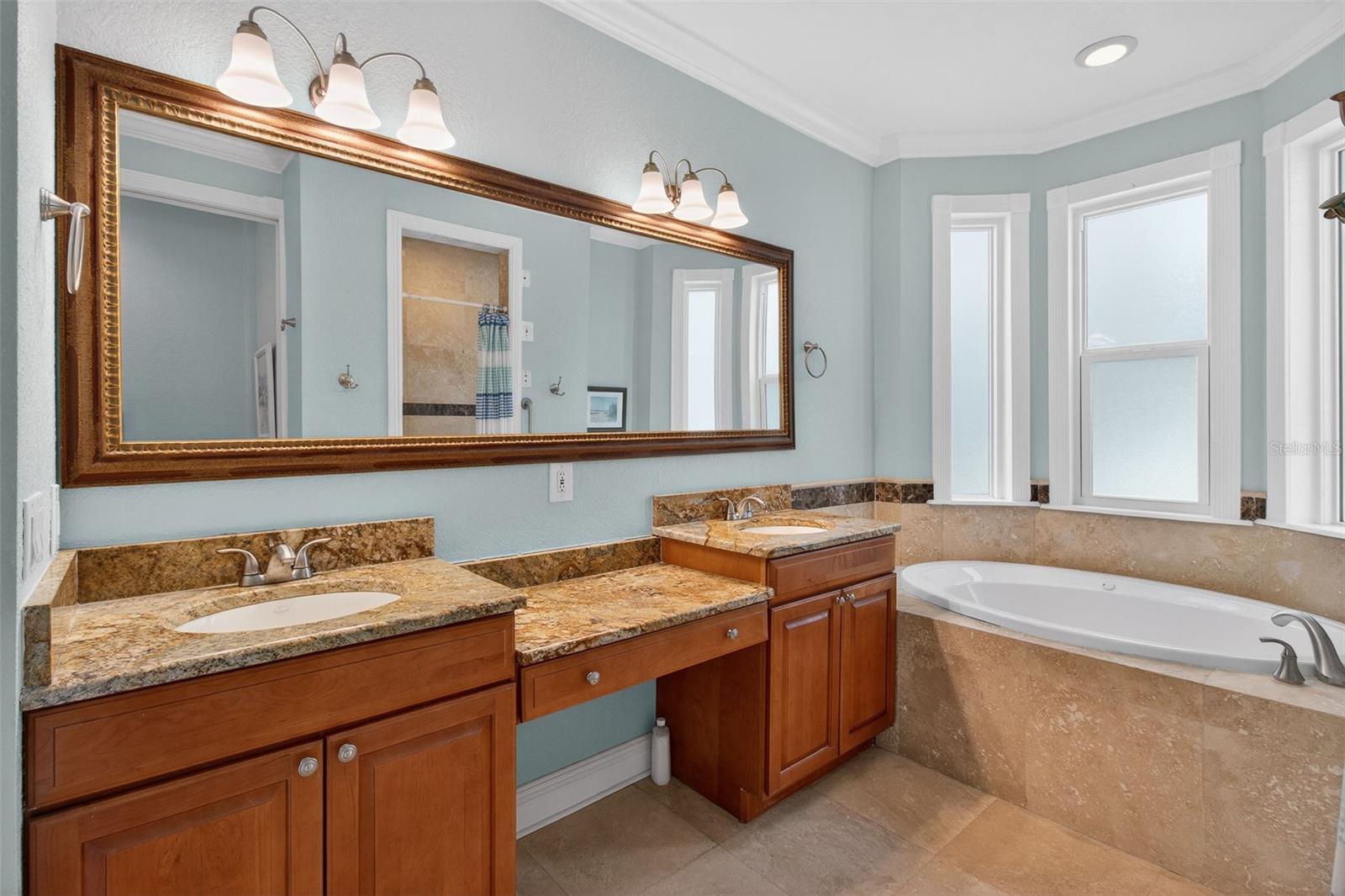 Double Sinks and Make Up vanity area Jacuzzi tub and separate shower and water closet