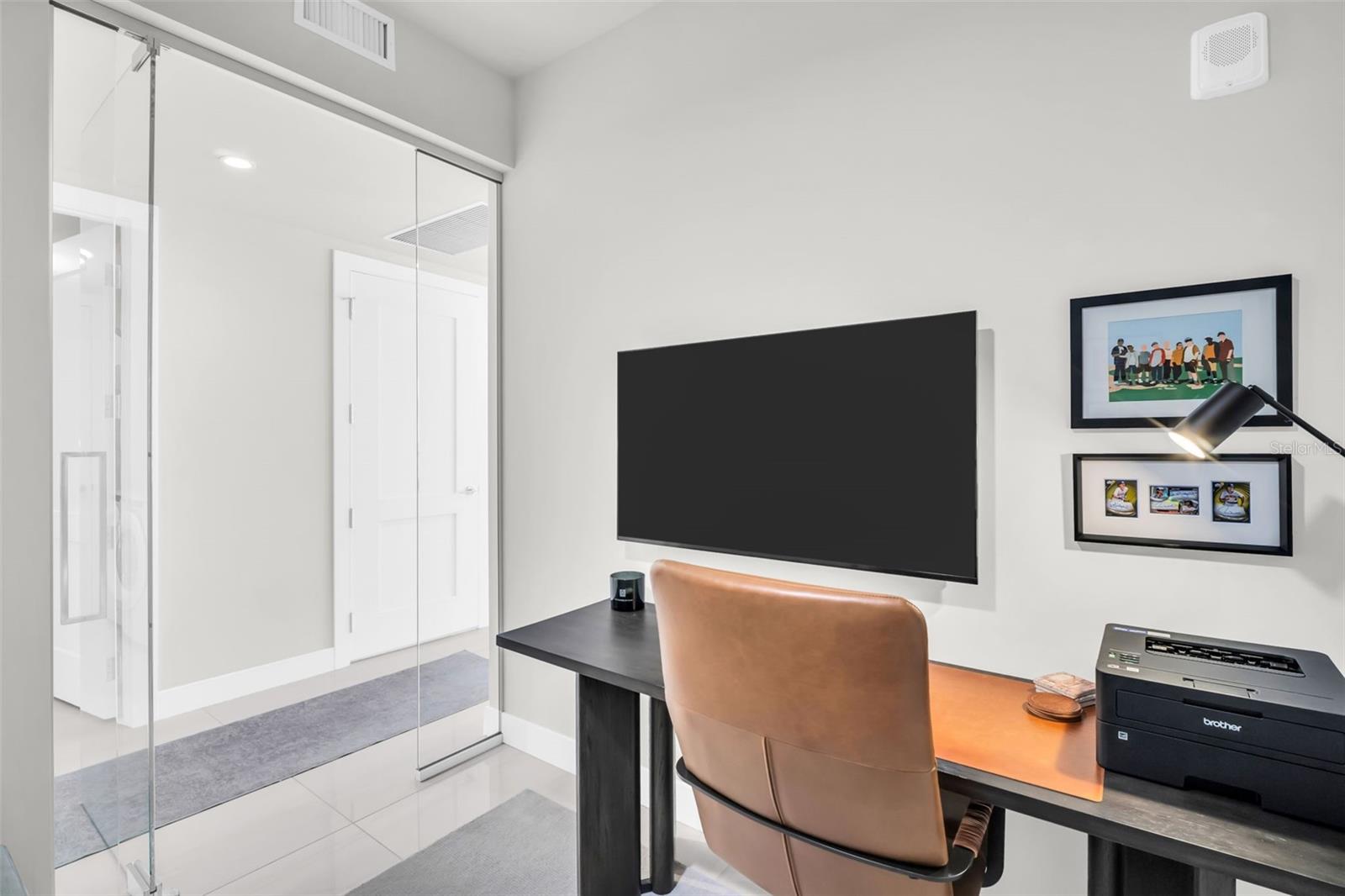 Den with custom glass door