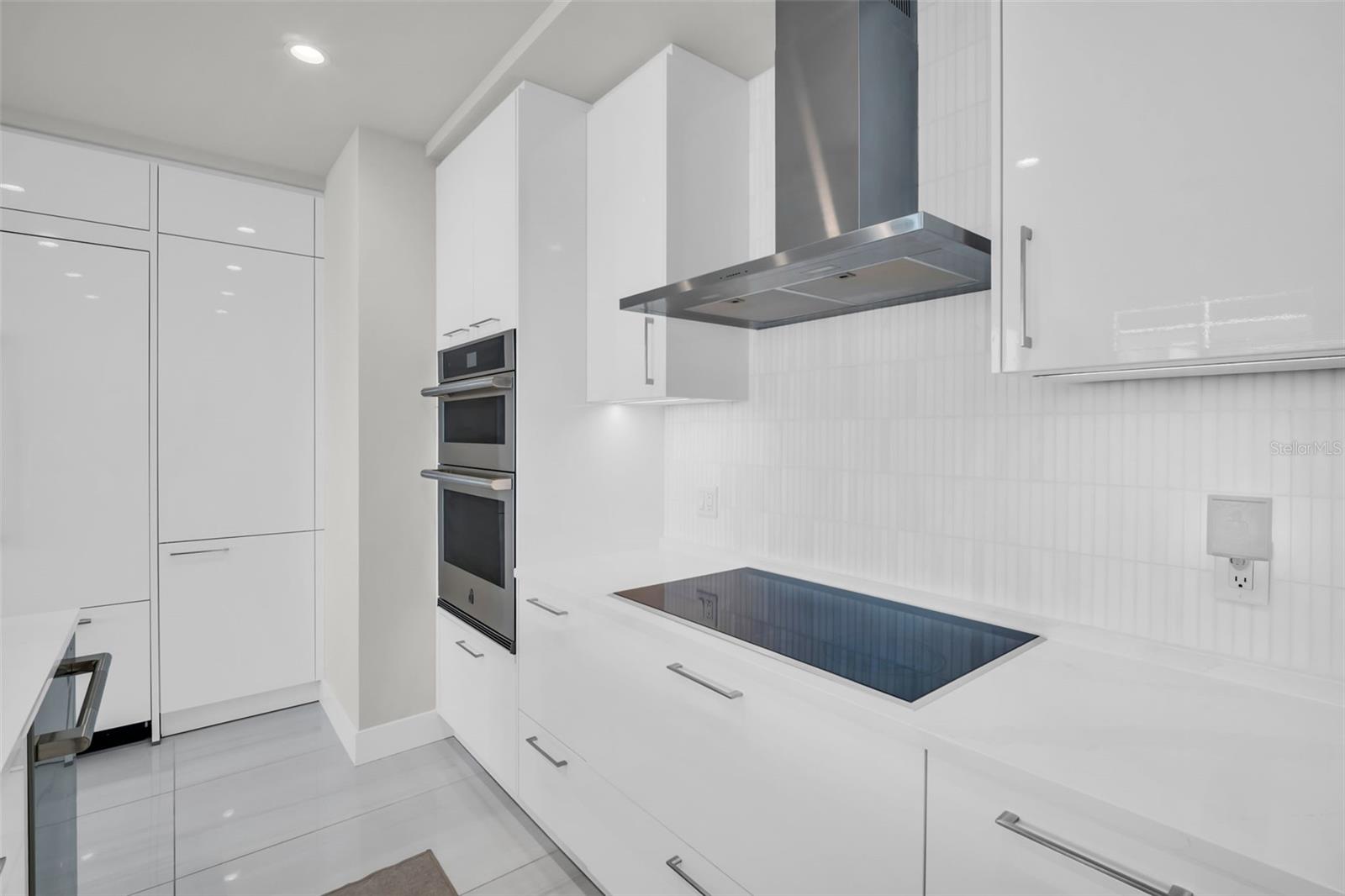 Jenn Air Induction cooktop and stainless steel vent