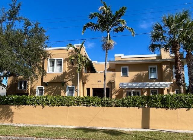 EMBRACED BY TROPICAL LANDSCAPING