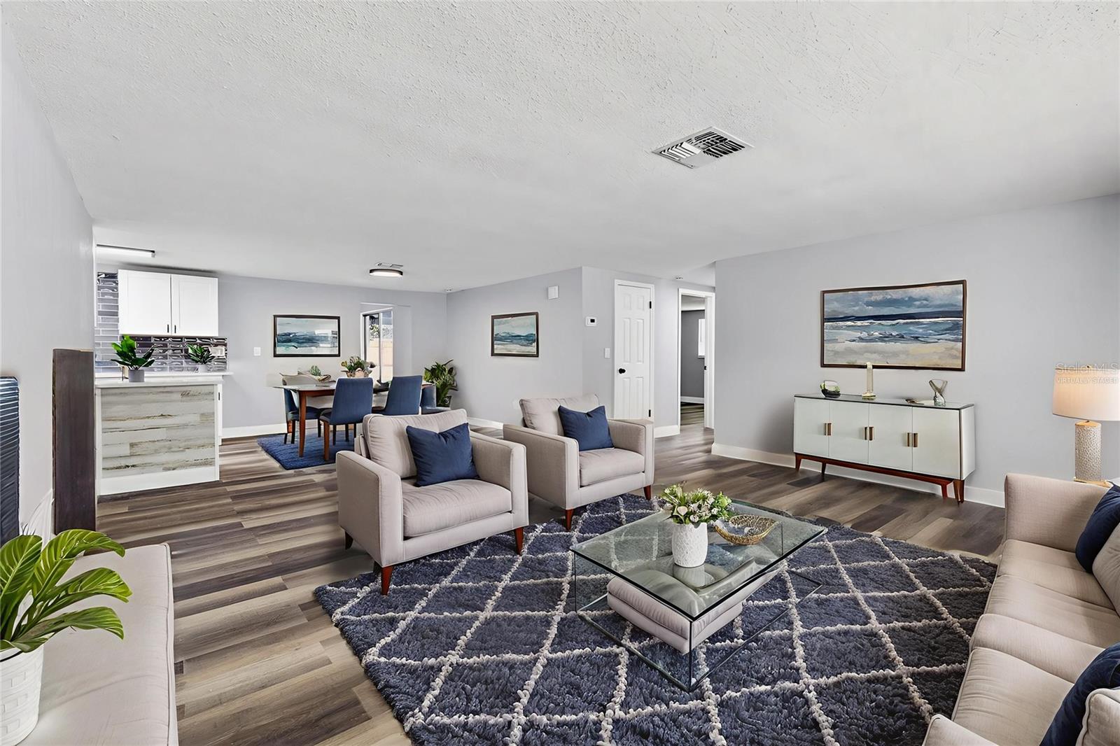 Living room/ dining room combo *VIRTUALLY STAGED*