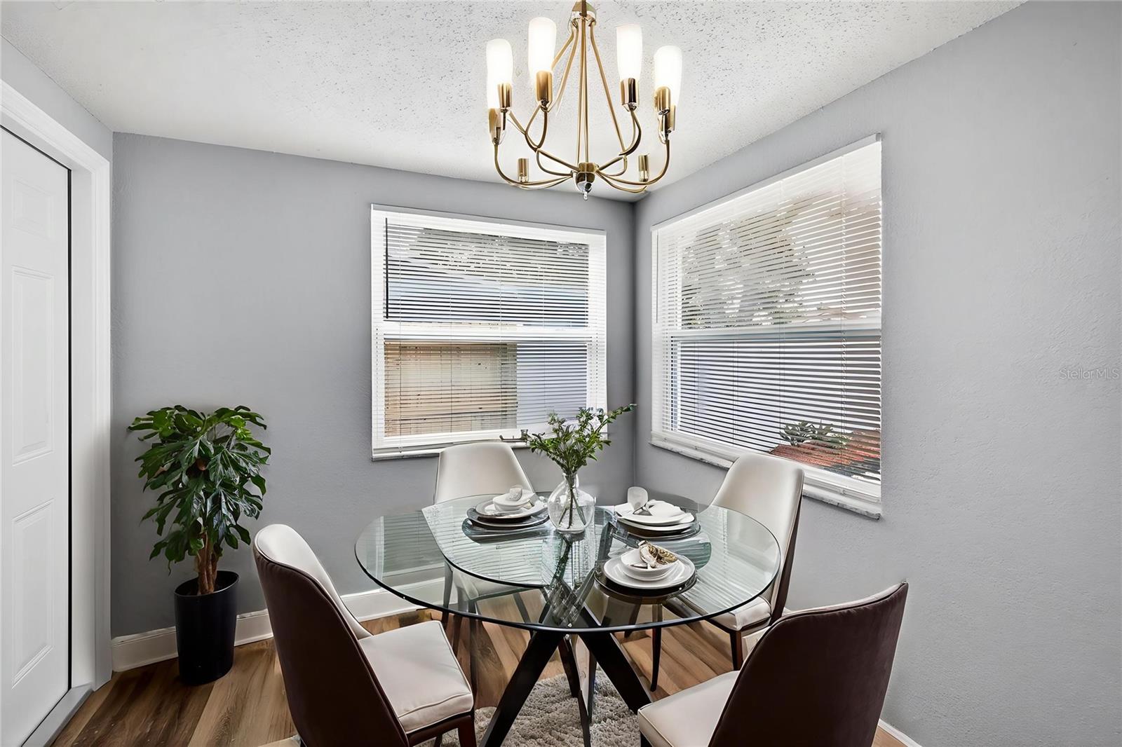 Kitchenette with plenty of natural light and view of the back yard